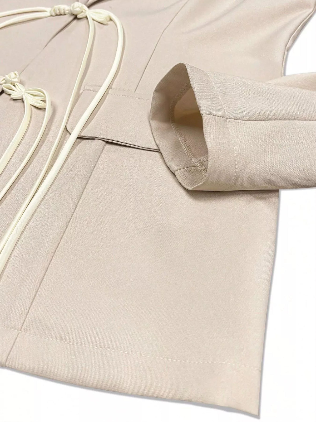 Women's Chinese-Style Knot Lapel Collar Blazer in beige — sleeve detail view