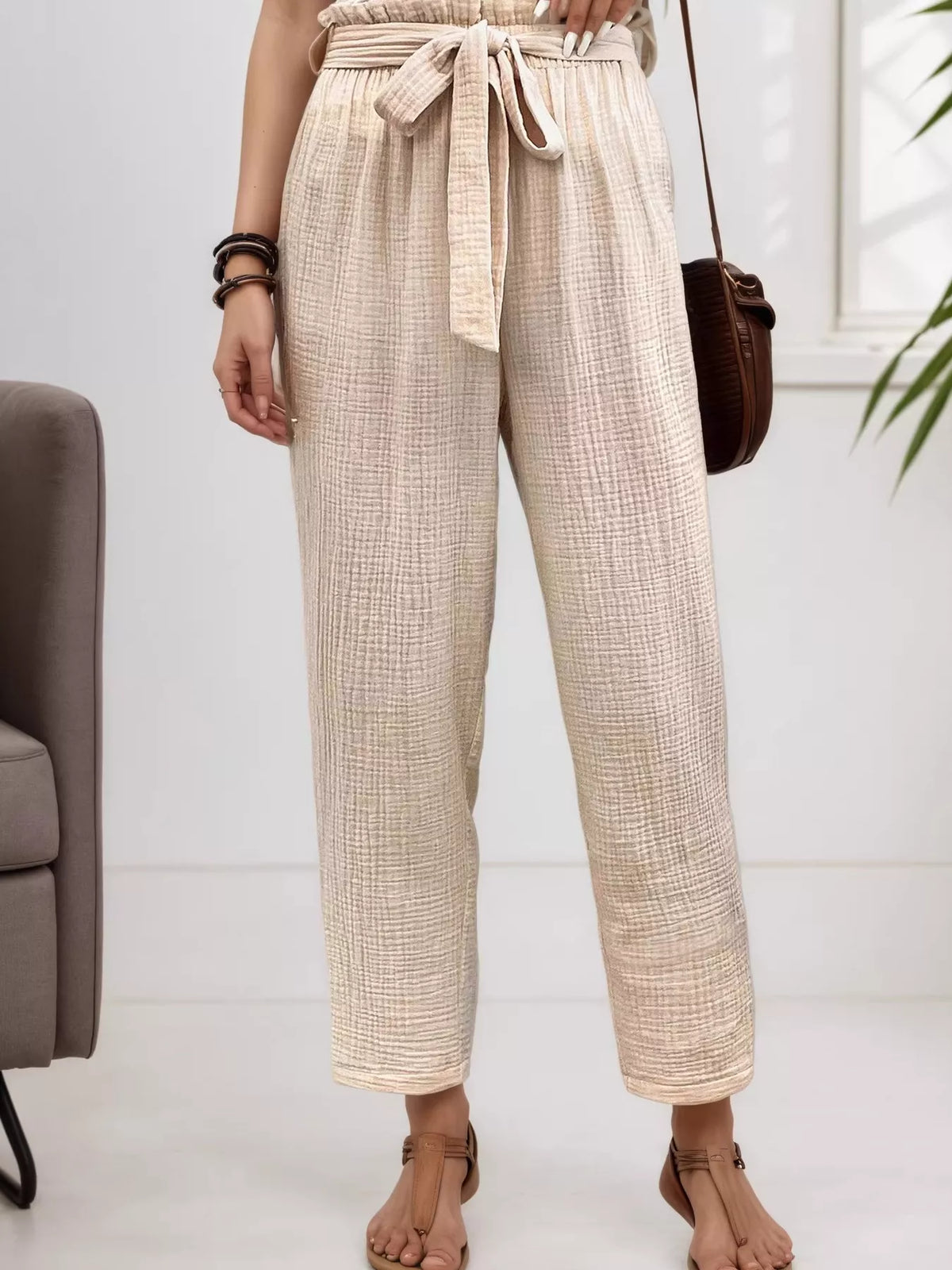 Beige high waisted paperbag waist textured casual pants, detail view