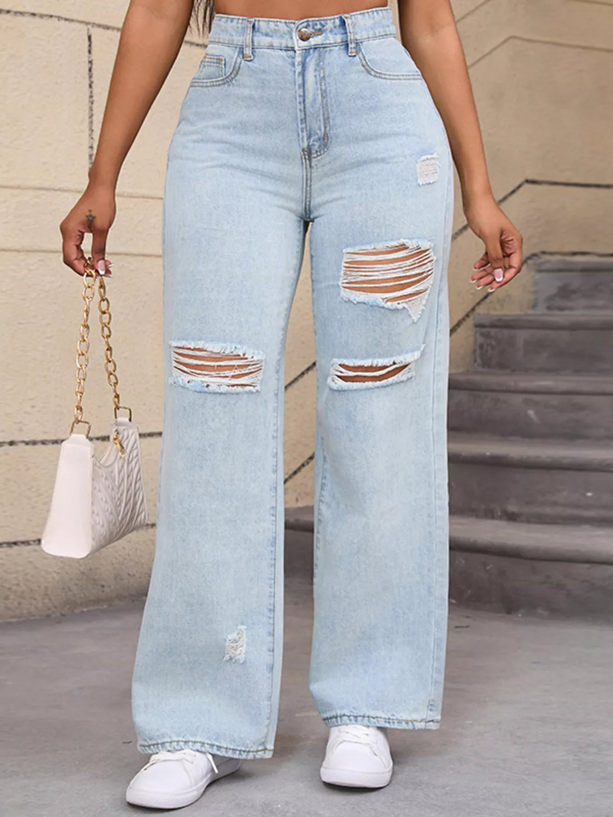 Light blue distressed wide-leg jeans, front leg detail