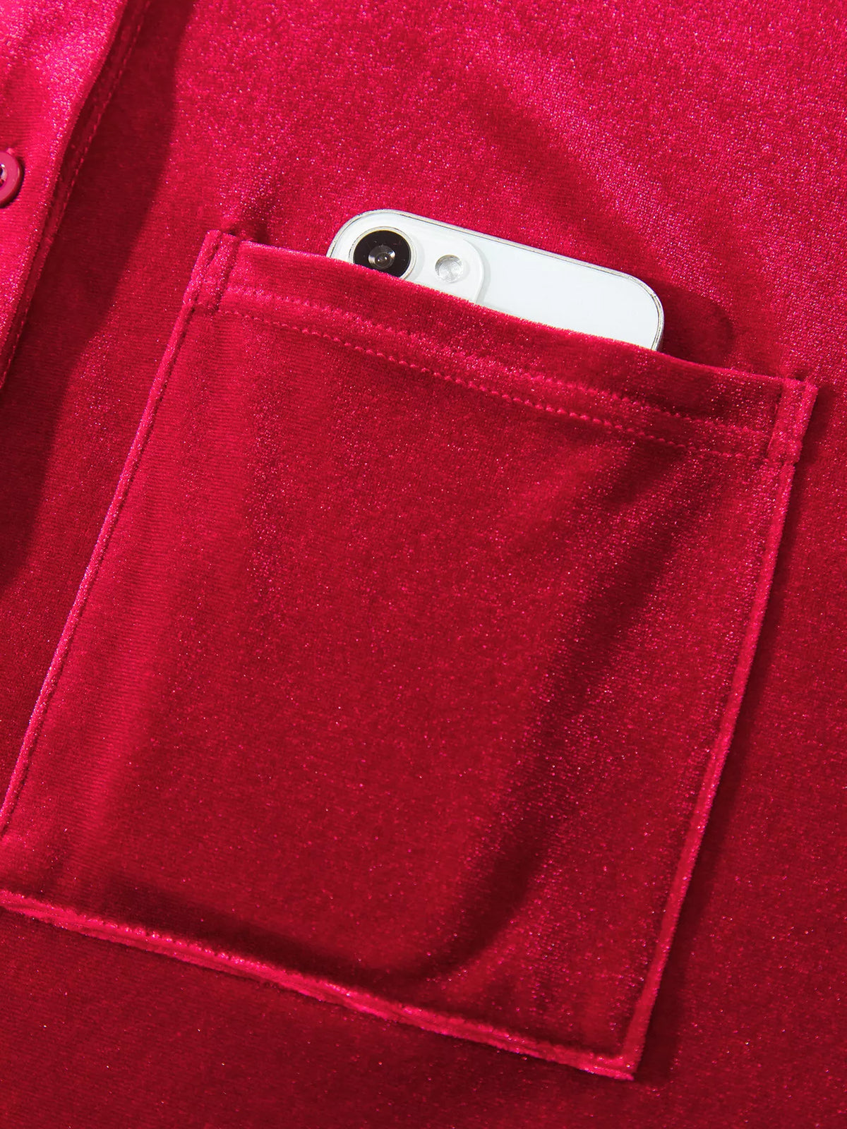 Chest pocket opening on red velvet button-down shirt with patch pockets