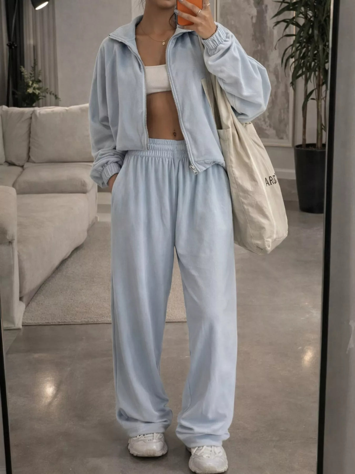Light blue zip-up outerwear and pants set — front view