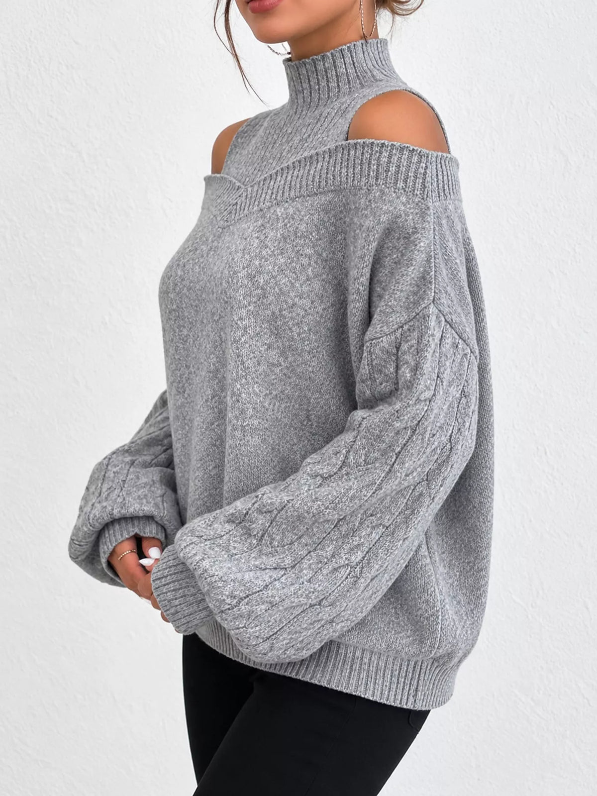 Gray cold shoulder mock neck cable knit sweater, side view