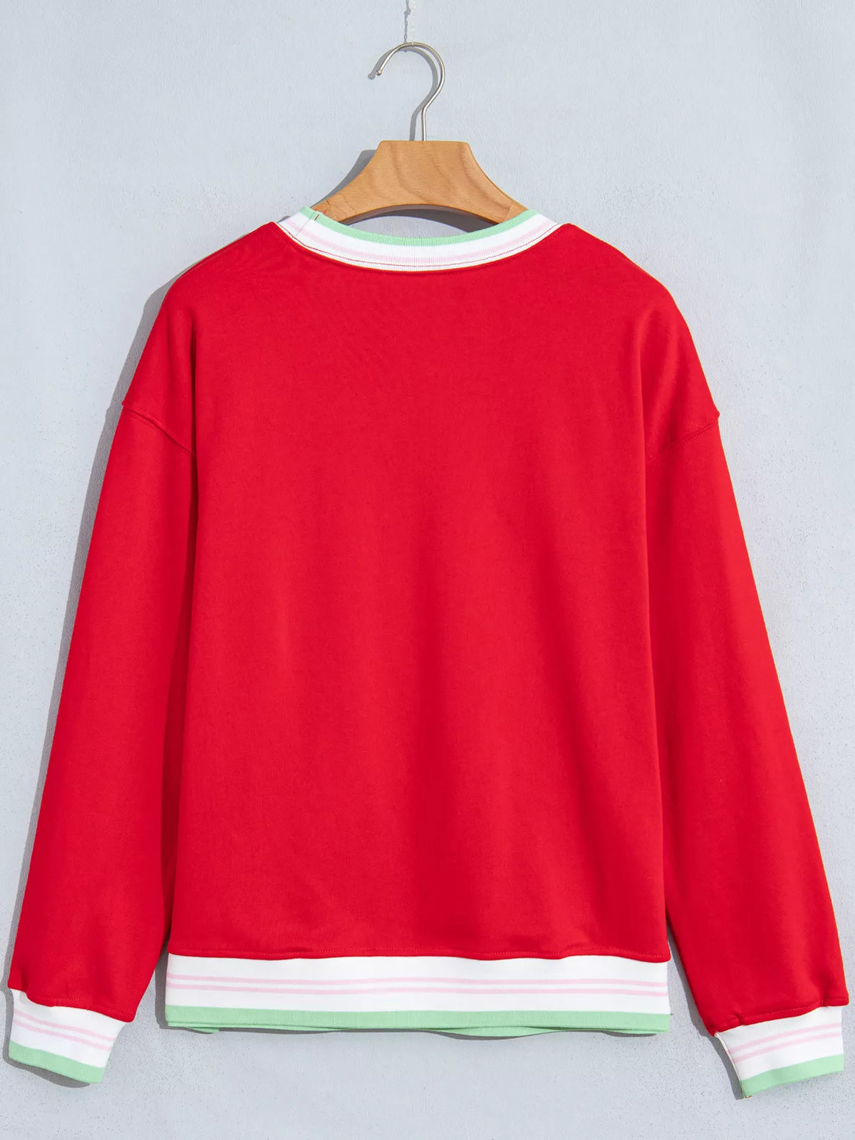 Red sweatshirt with contrast striped ribbed trim, back view