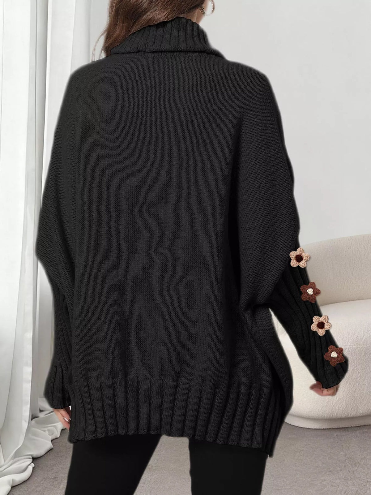 Black oversized floral sleeve turtleneck sweater, back view
