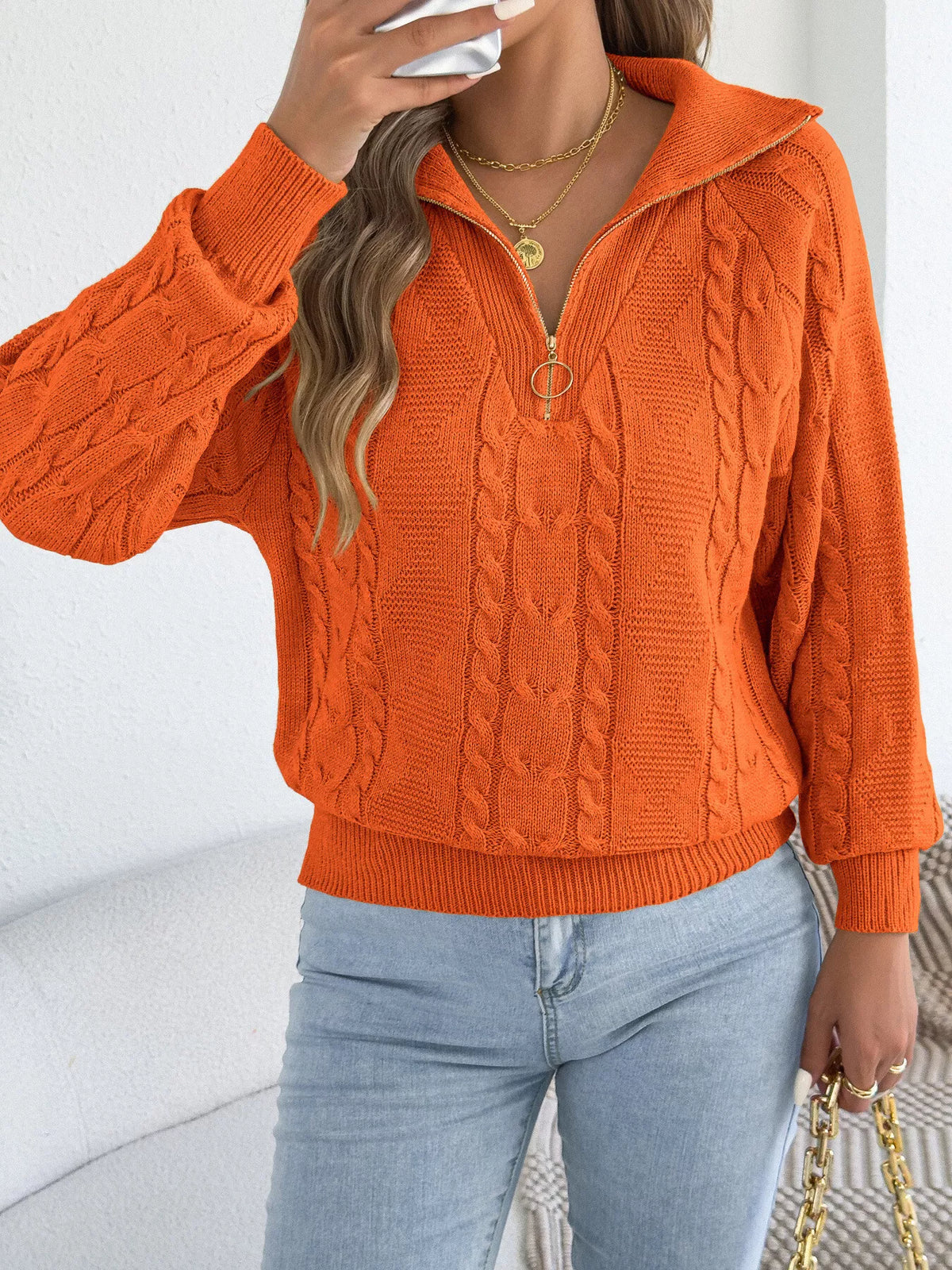 Orange quarter-zip cable knit sweater
