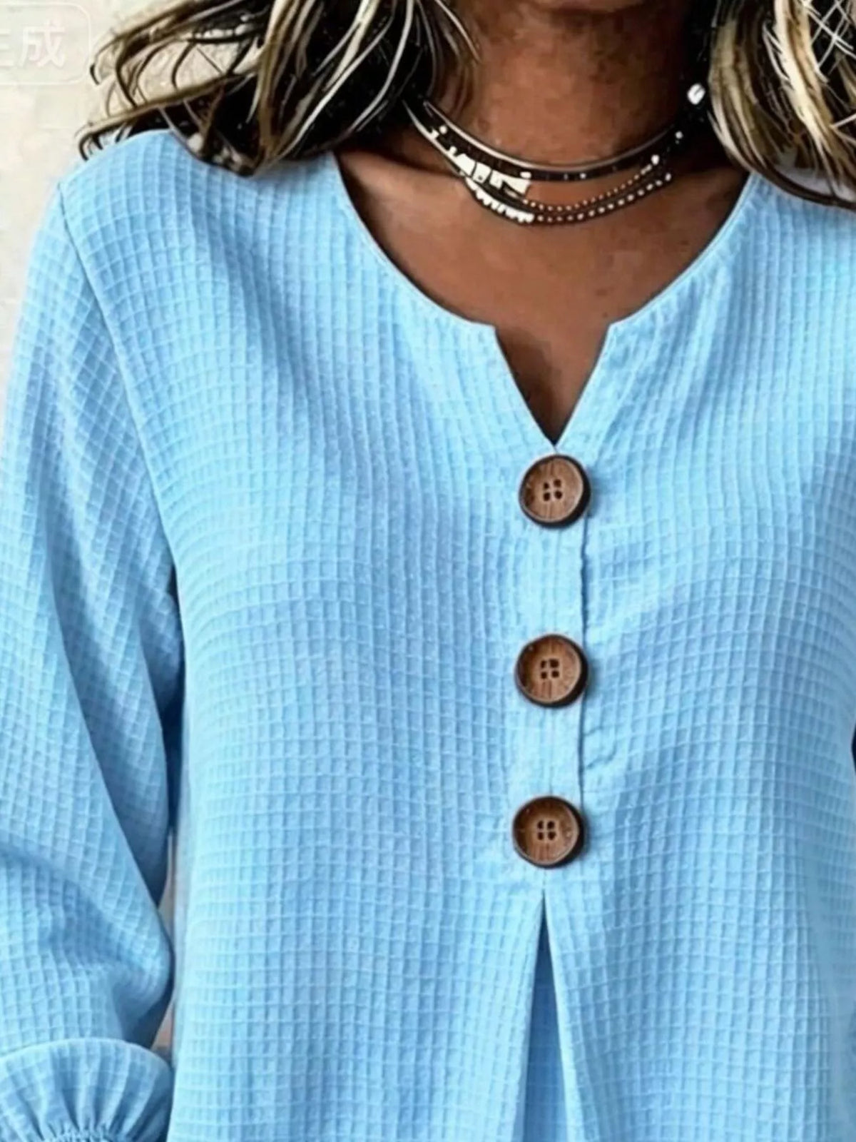 Light blue waffle knit blouse, split neckline and buttons