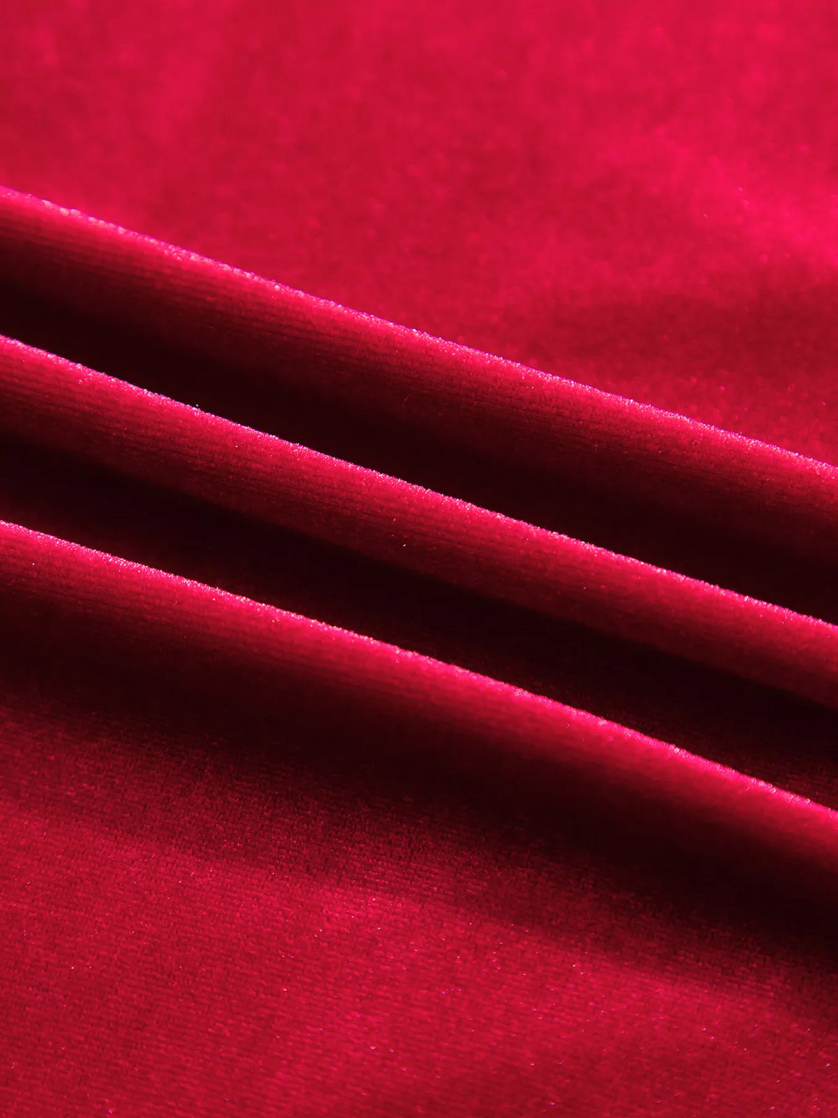 Fabric close-up on red velvet button-down shirt with patch pockets
