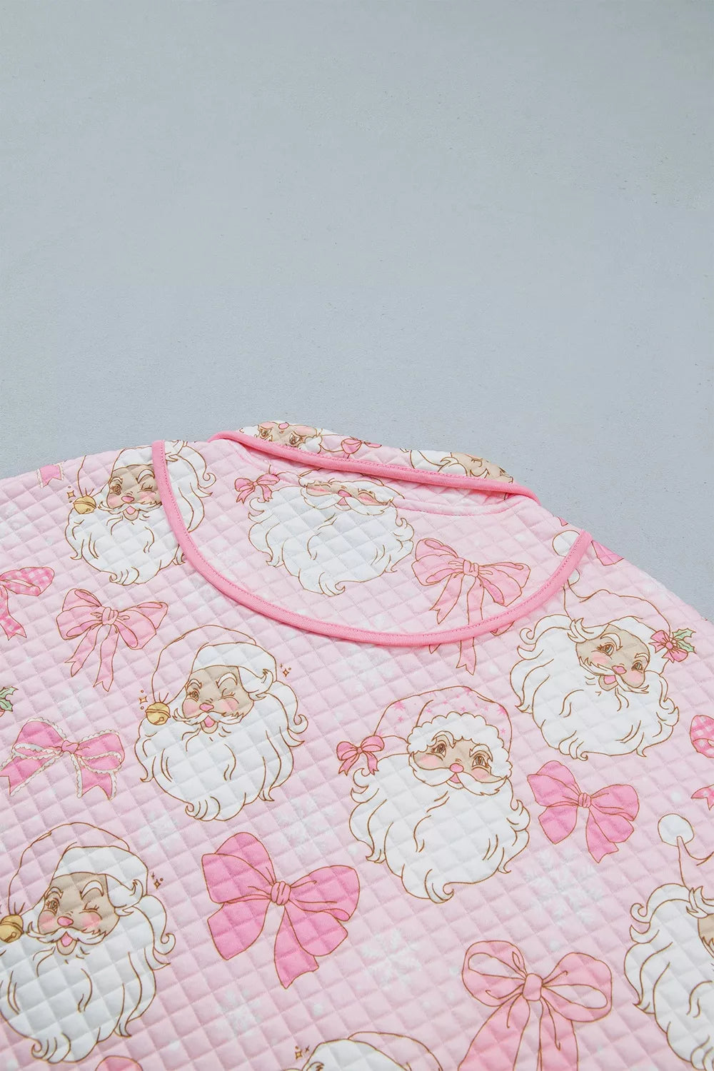 Back neckline on pink santa print christmas print quarter-zip sweatshirt