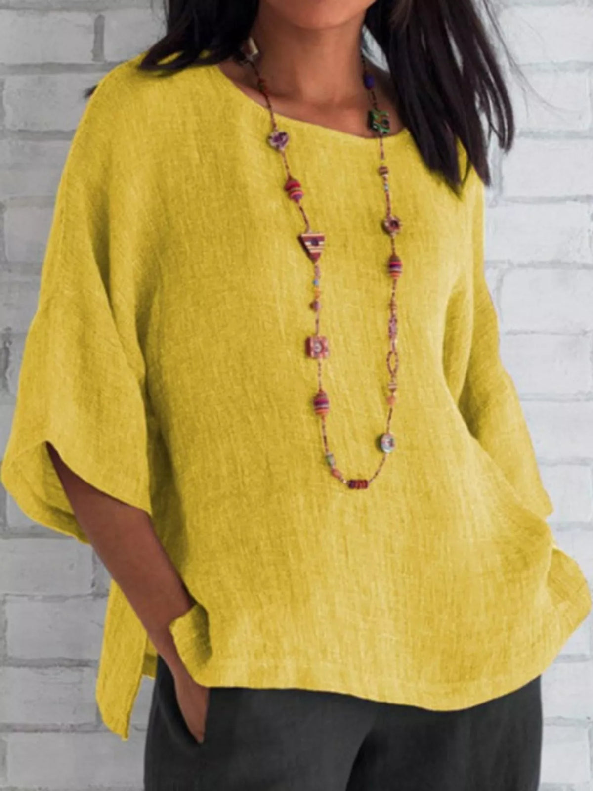 Slit blouse, yellow front