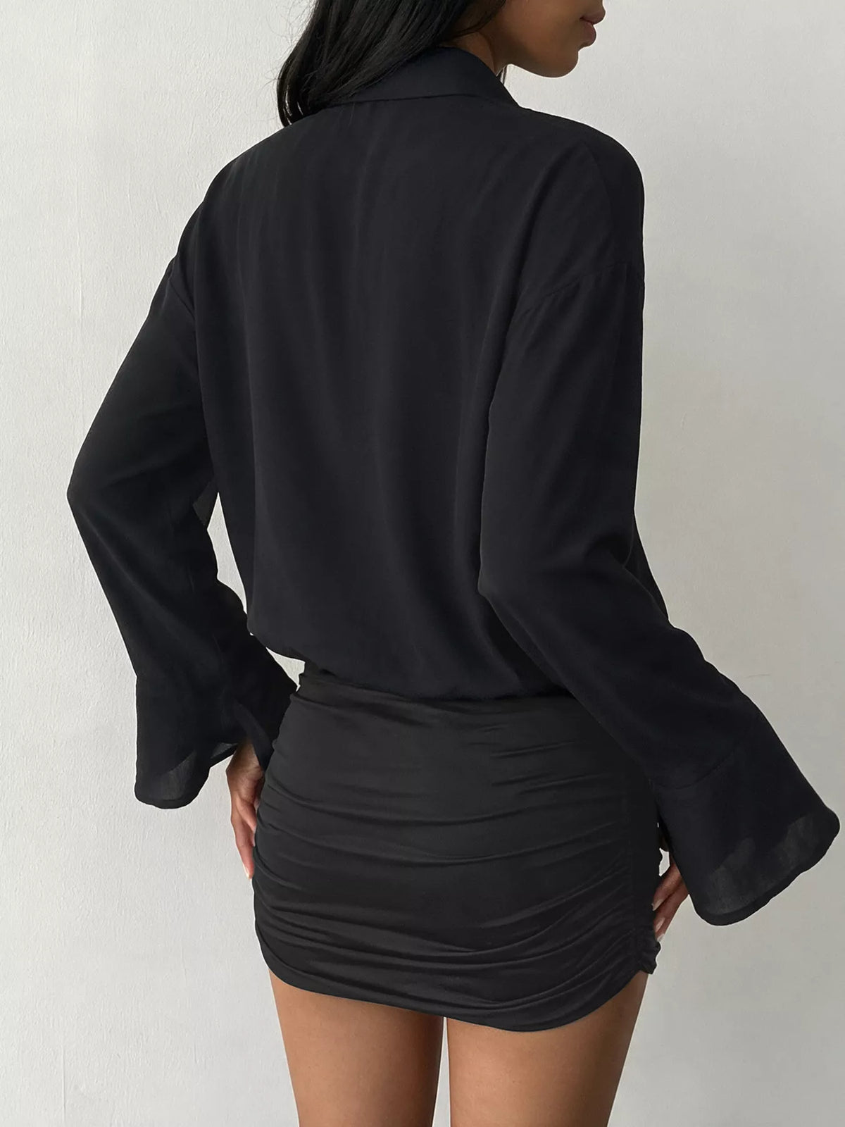 Black flounce sleeve ruched mini shirt dress, back view
