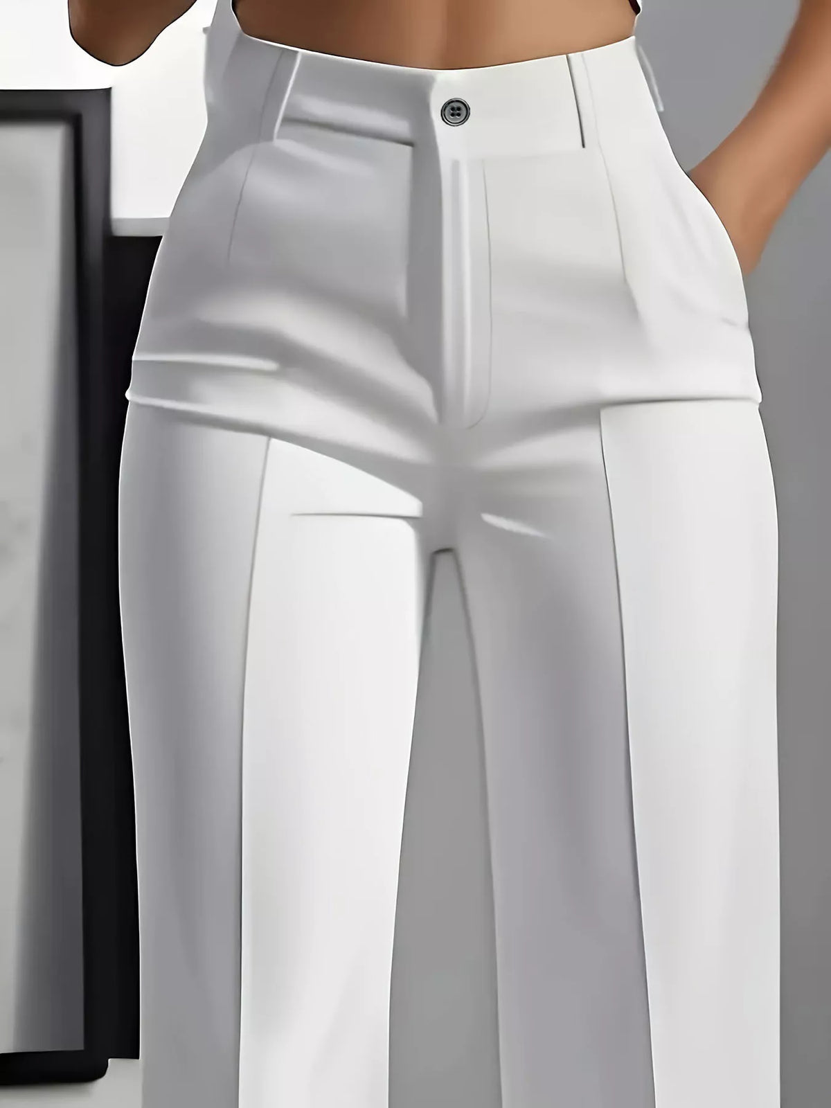 White high-waisted wide-leg pants, waistband and pocket detail
