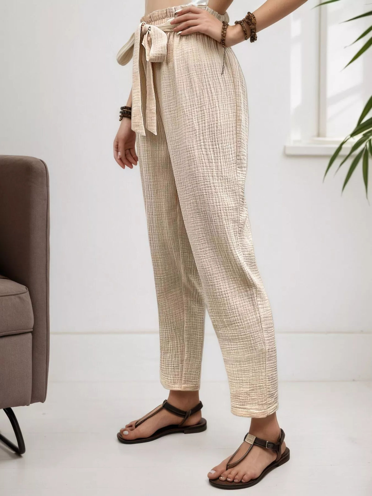 Beige high waisted paperbag waist textured casual pants, side view