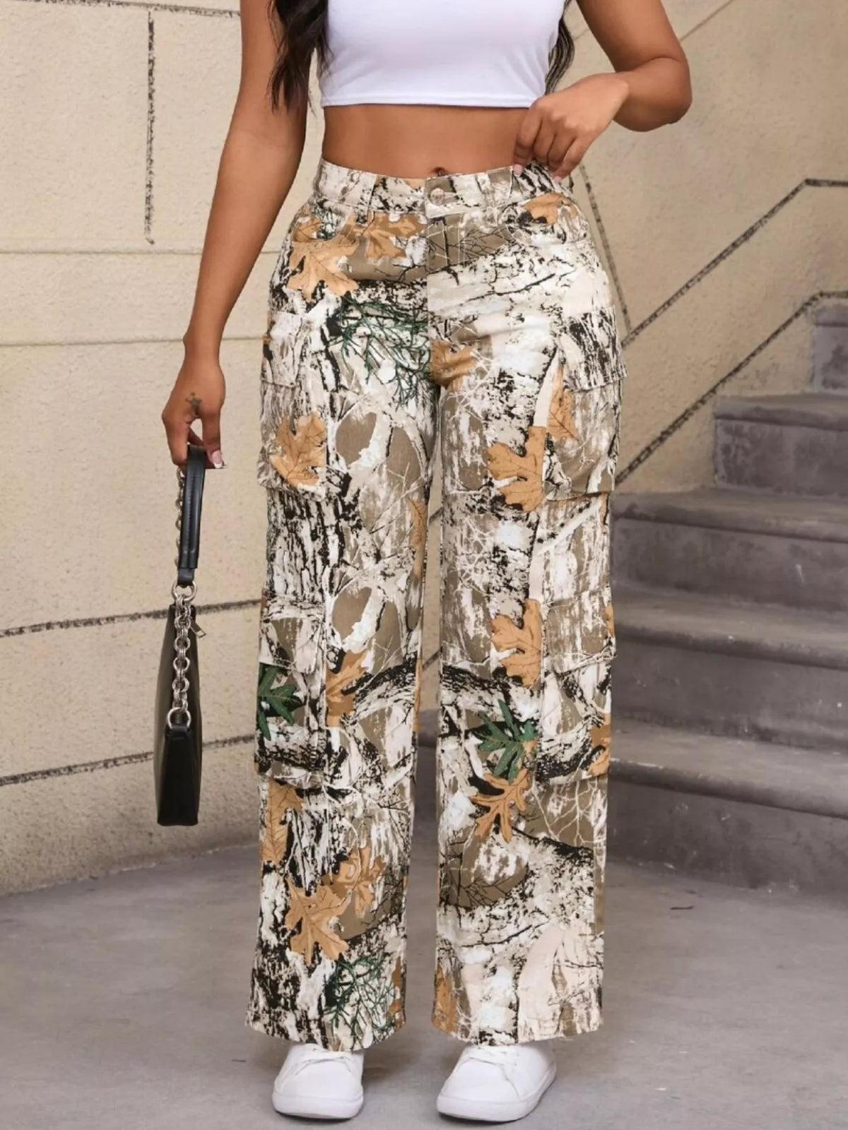 Beige and green high-waisted camouflage cargo pants, front view.