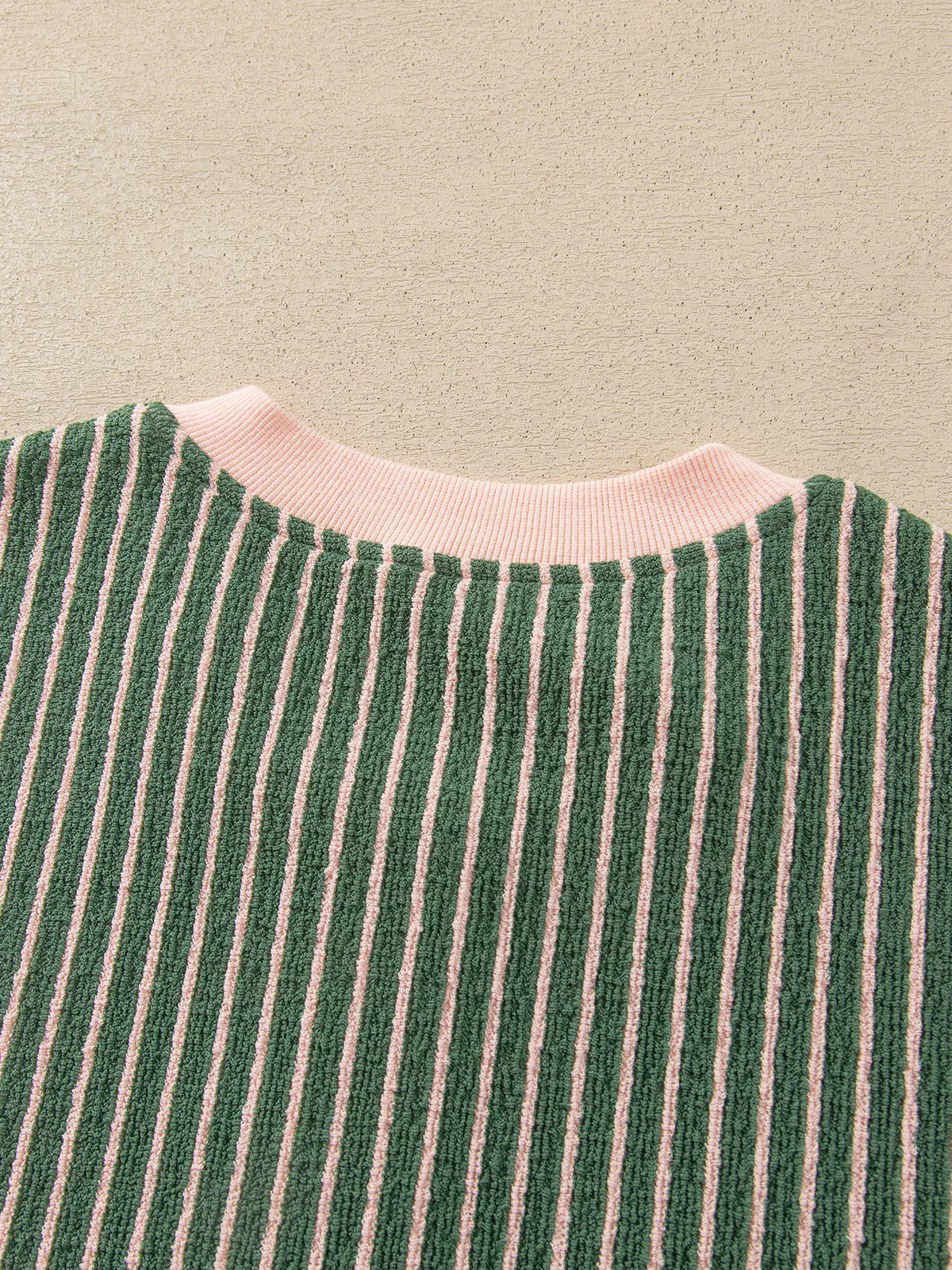 Back neckline on green and pink striped striped round neck patchwork cardigan
