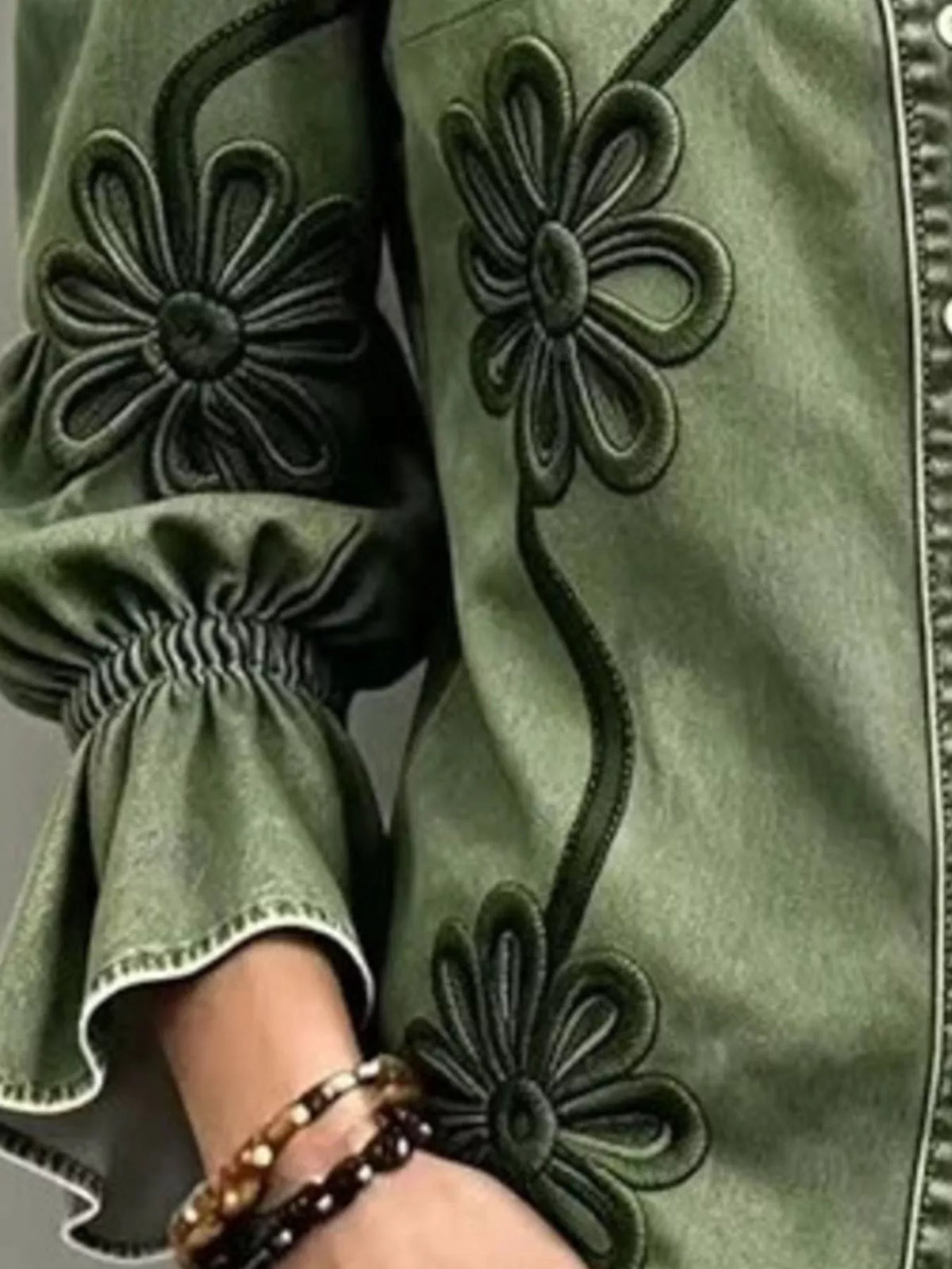 Green floral-embroidered button-down shirt, elastic cuff and embroidery detail.