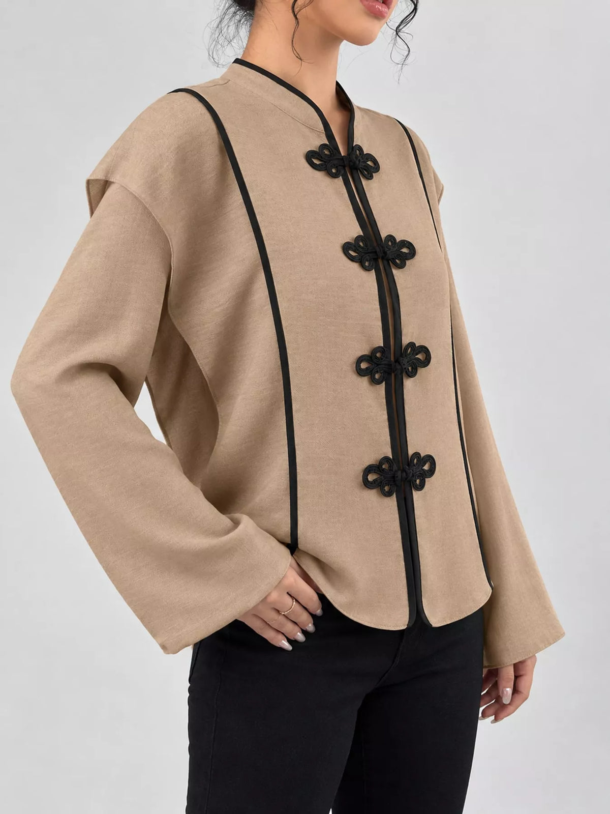 Brown chinese-style mandarin collar blouse, side view