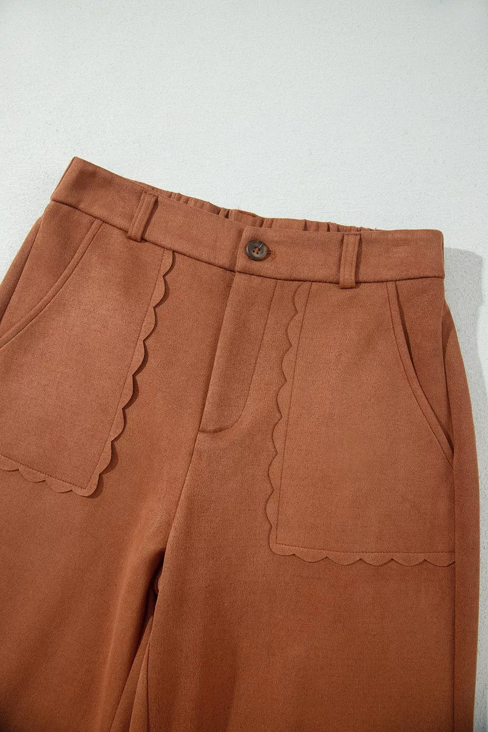 Brown scalloped-pocket wide-leg pants, front waist detail