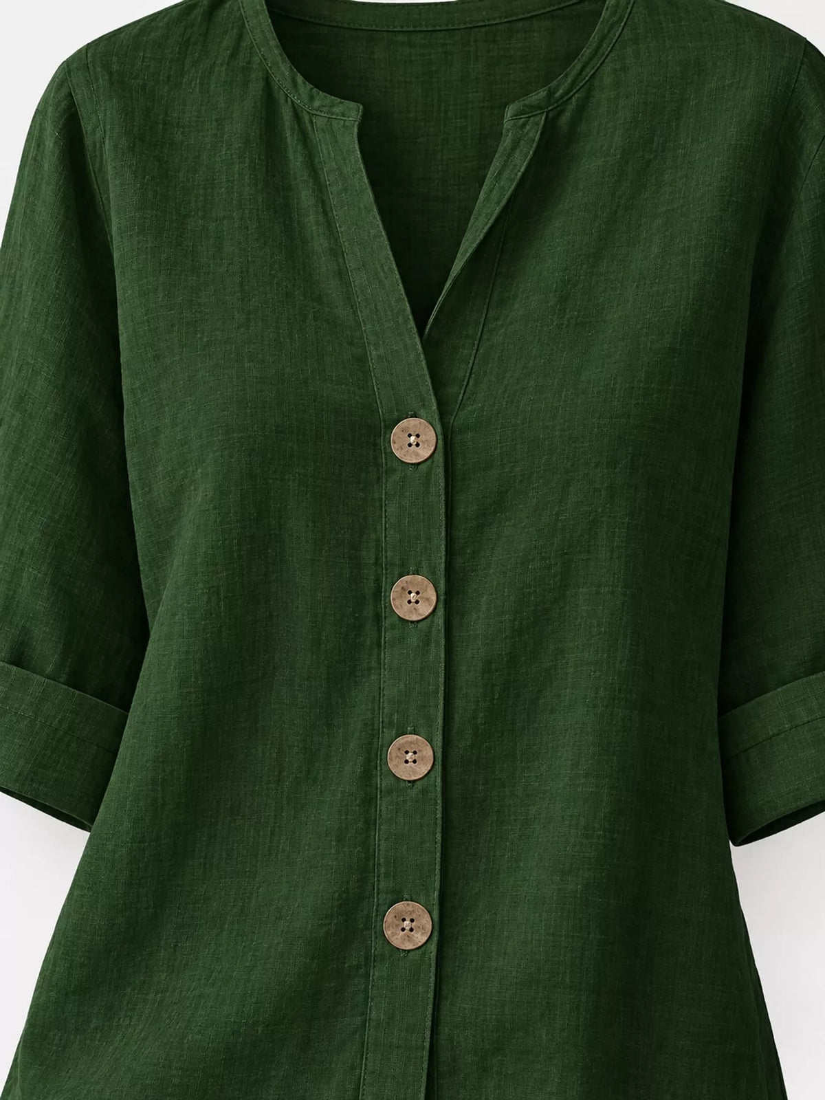 Notched-neck shirt, green neckline button cuff and hem details