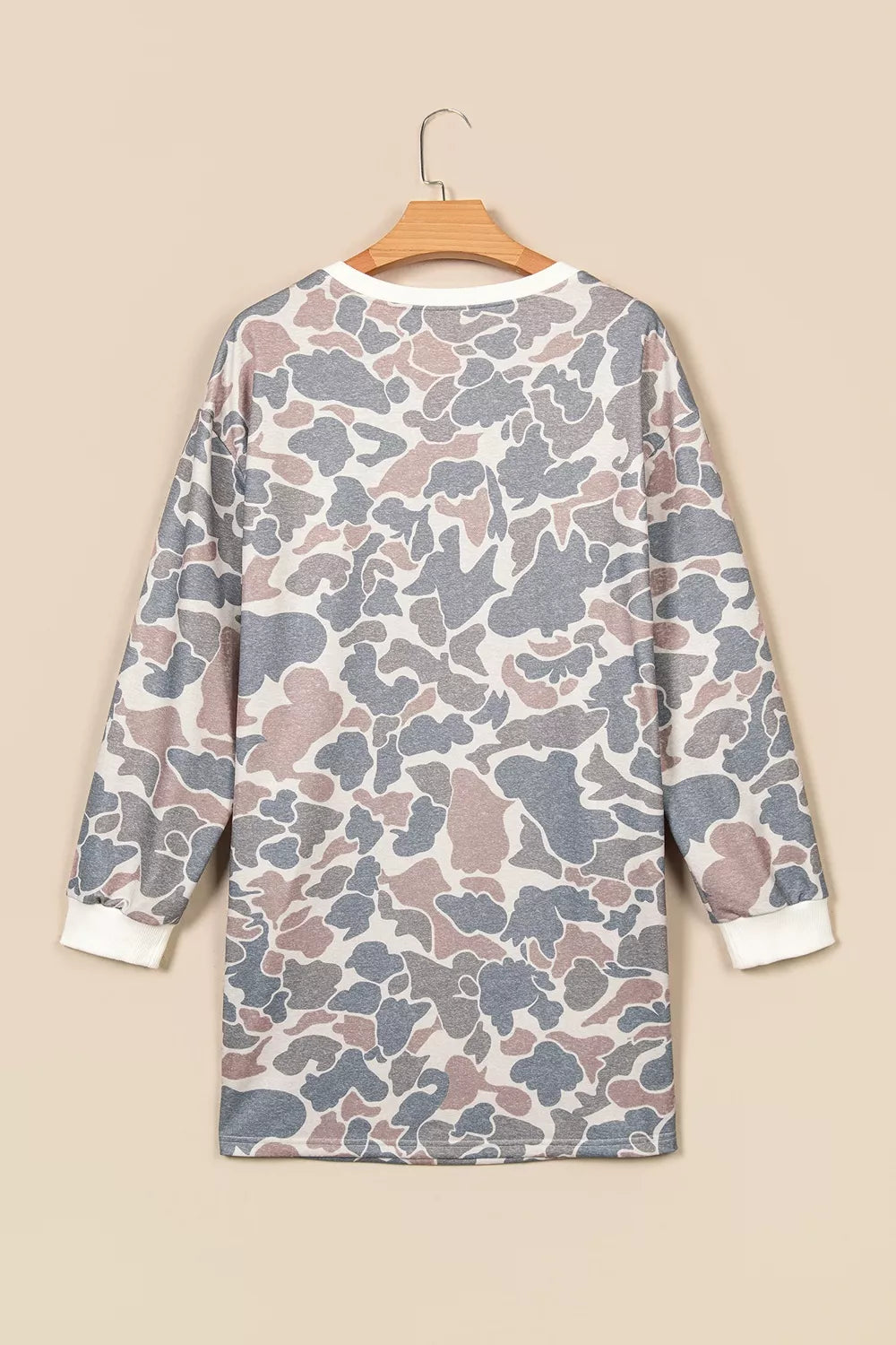 Gray and beige botanical camo mini dress with white ribbed cuffs and side pockets, back view