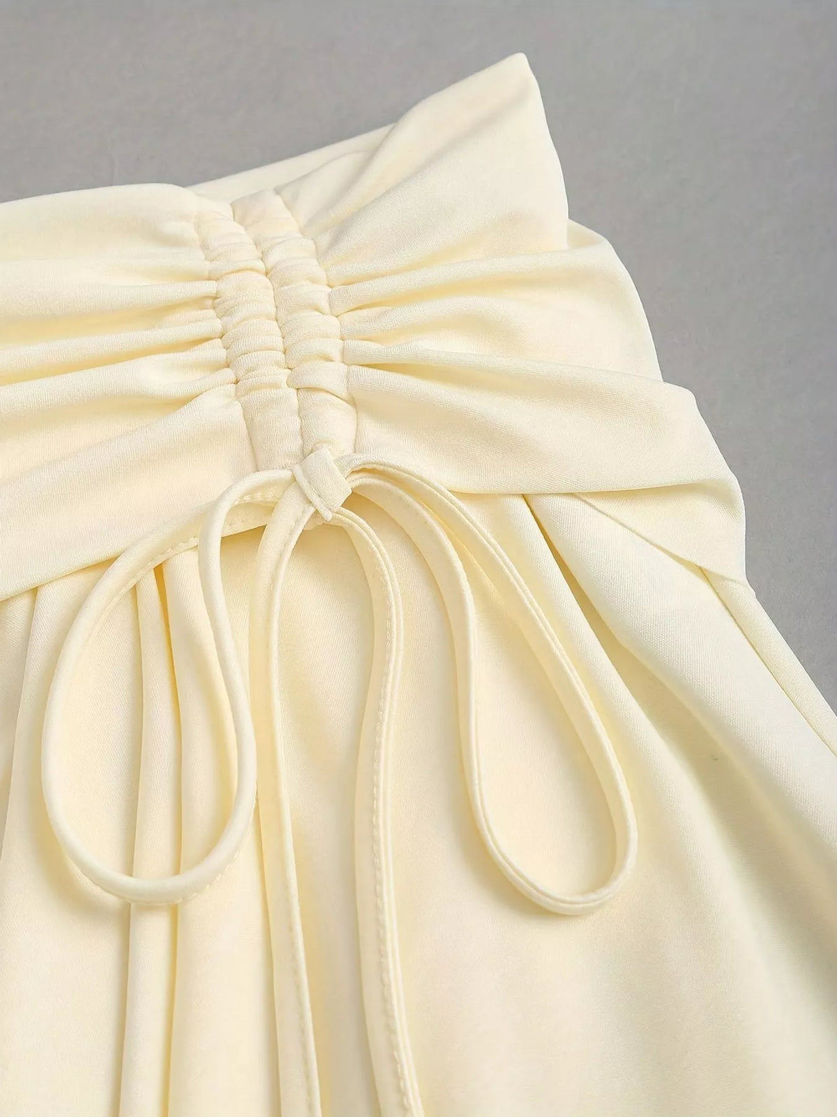 Ruched Asymmetrical Drawstring Mini Skirt, detail view in cream