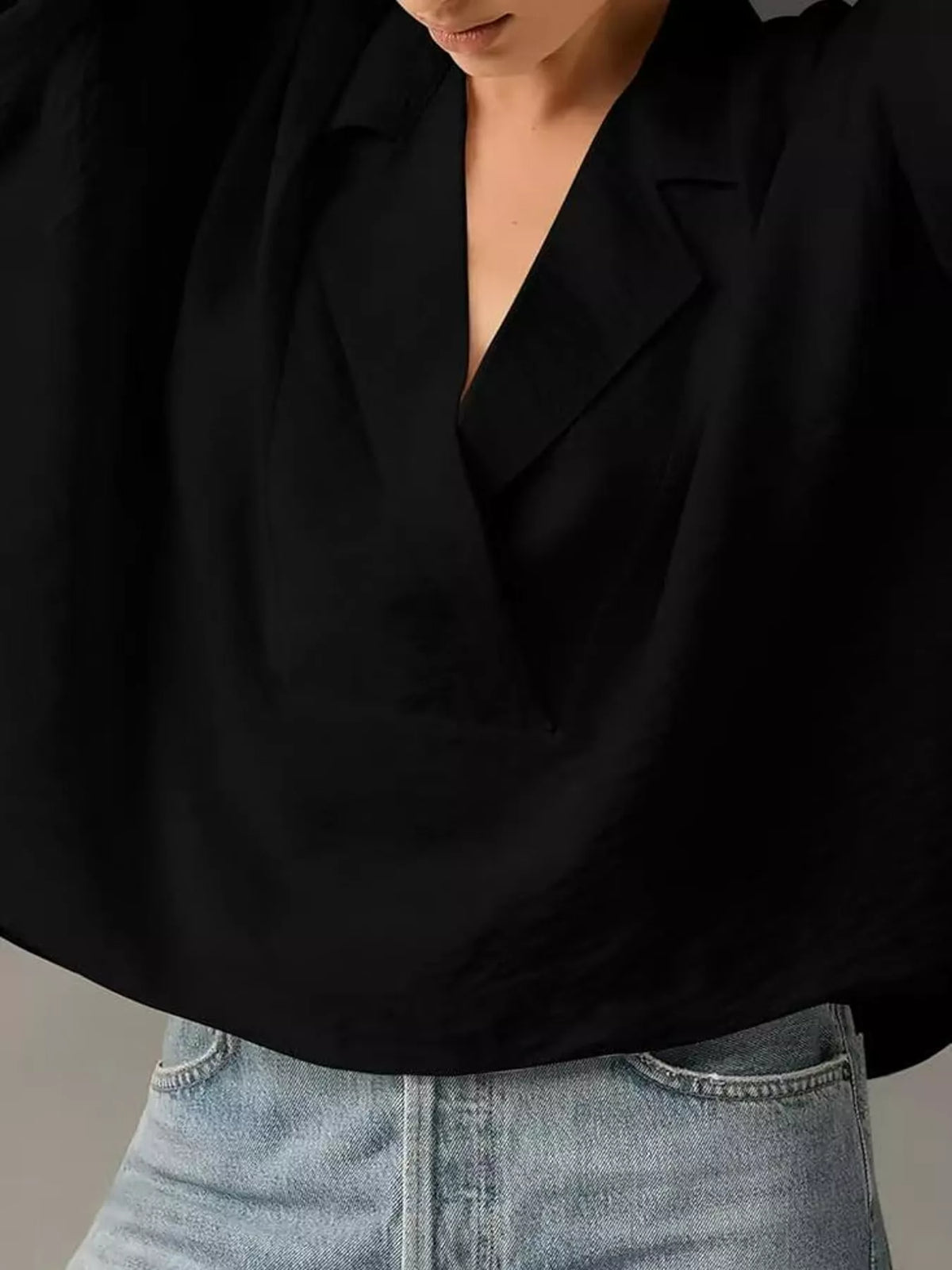 Half-sleeve blouse, black lapel close up