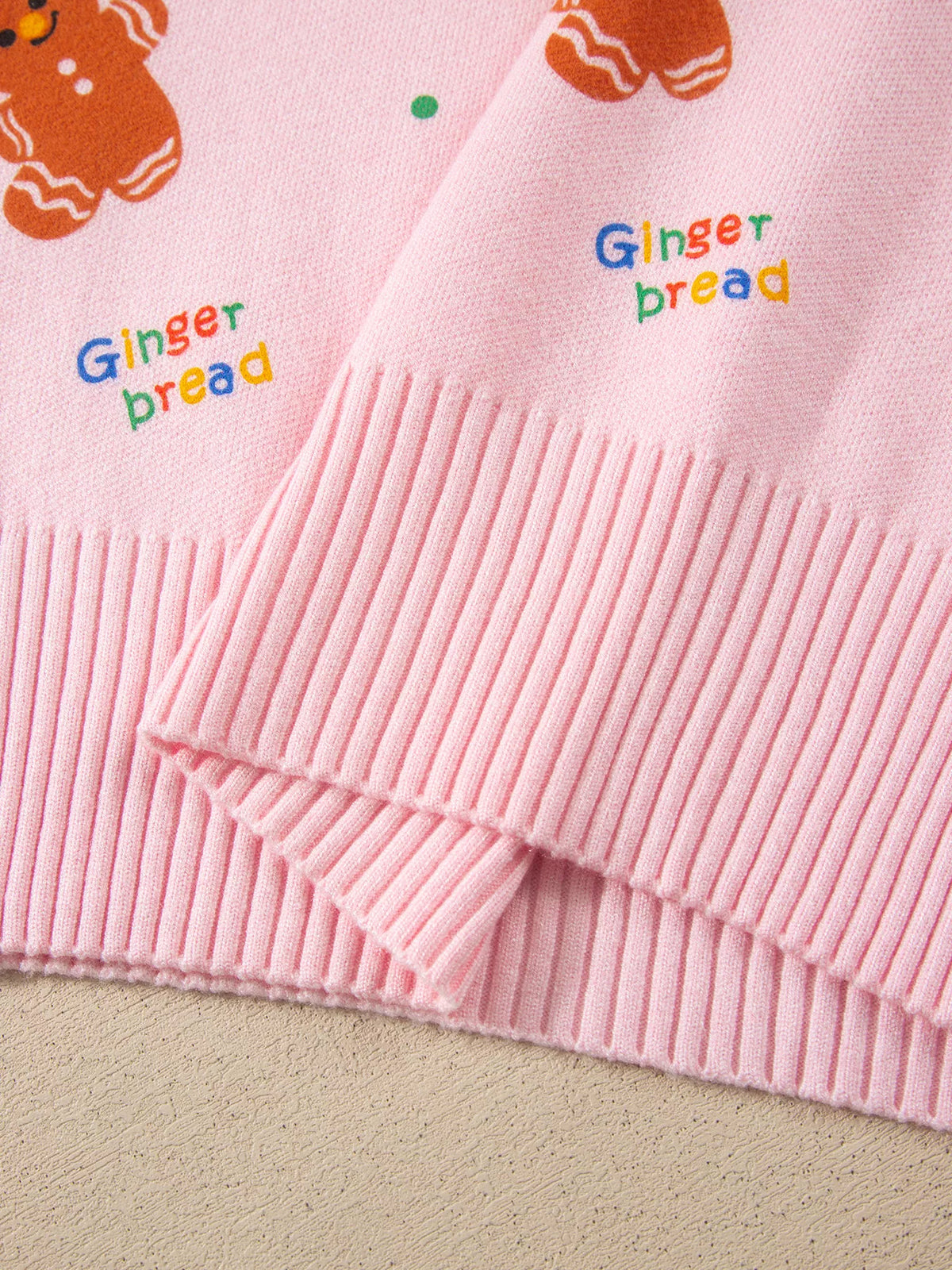 Gingerbread Pattern Long Sleeve Round Neck Sweater in pink, hem detail