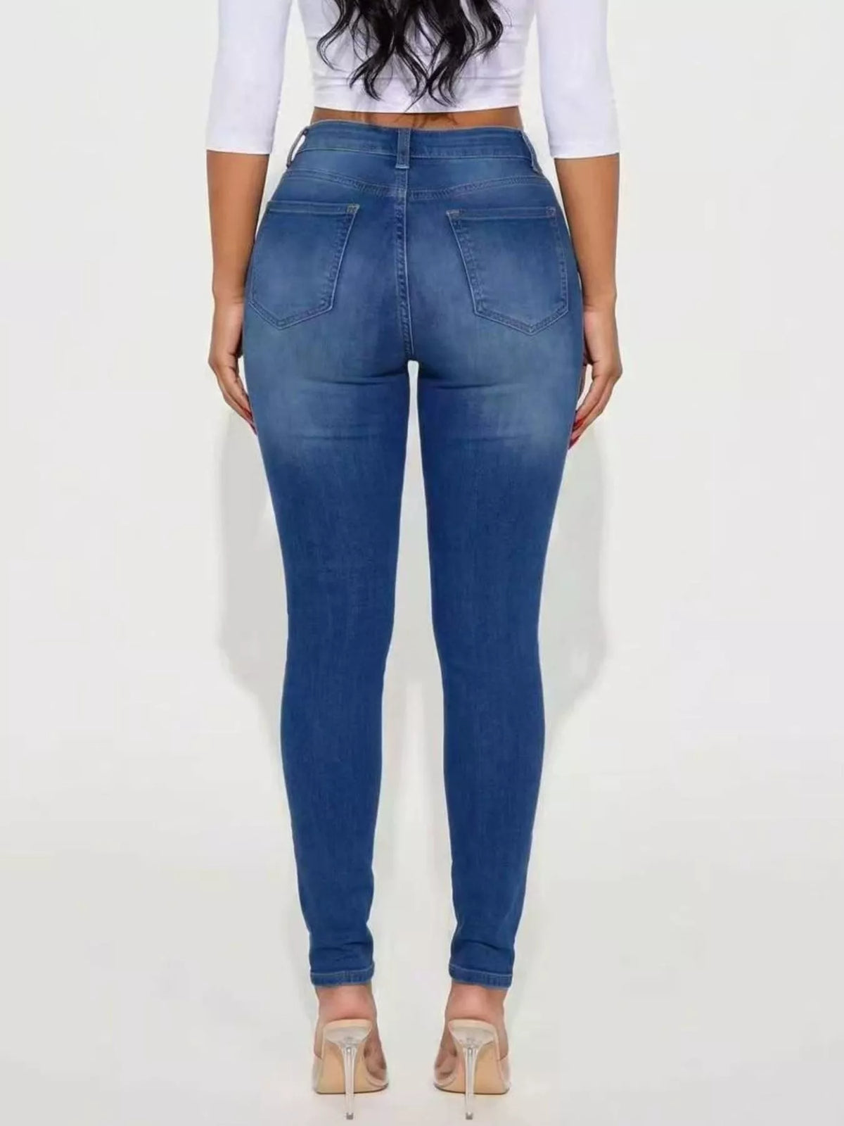 High-Waisted Distressed Skinny Jeans in blue, back view