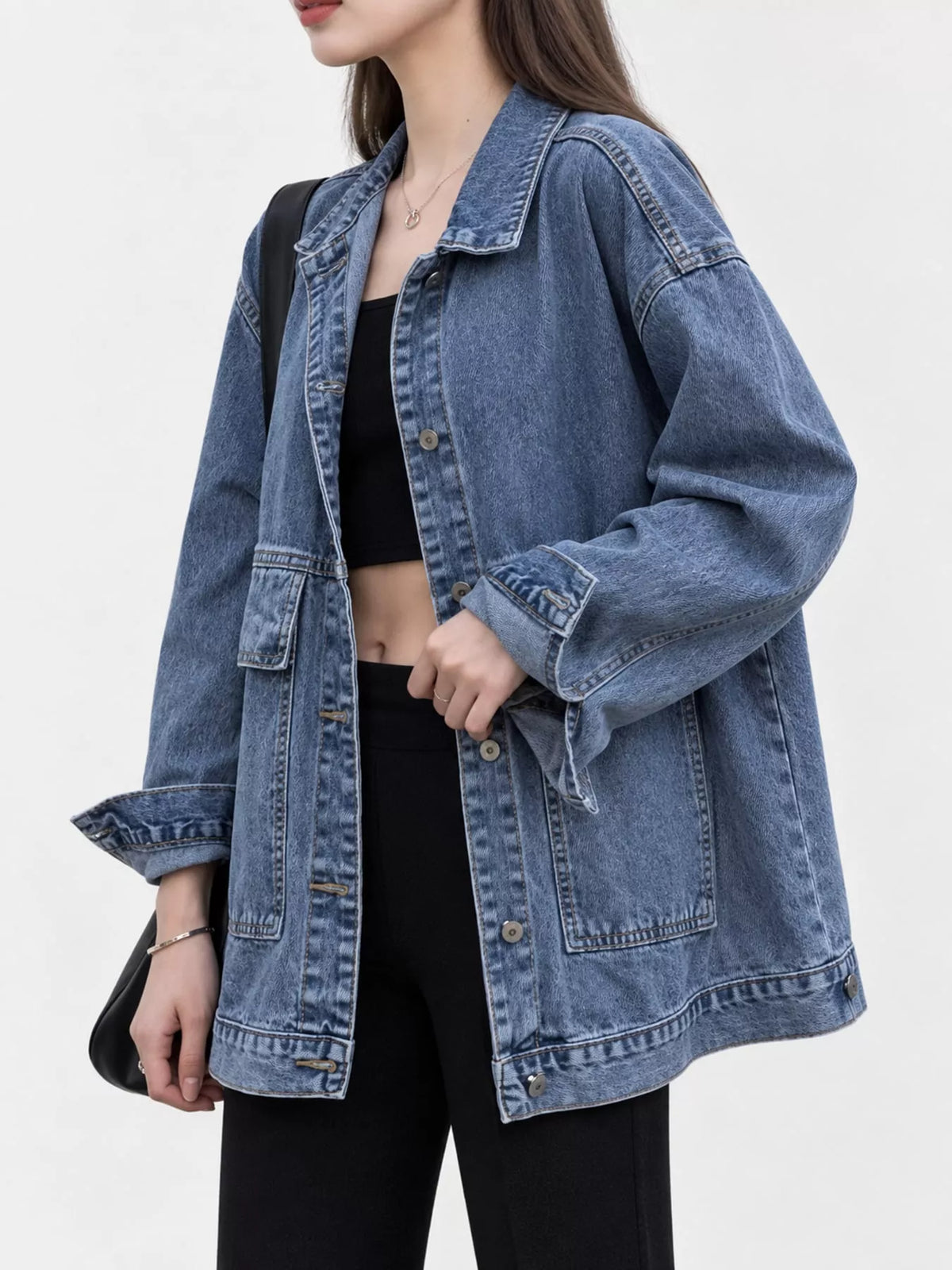 Blue washed denim utility jacket, side view