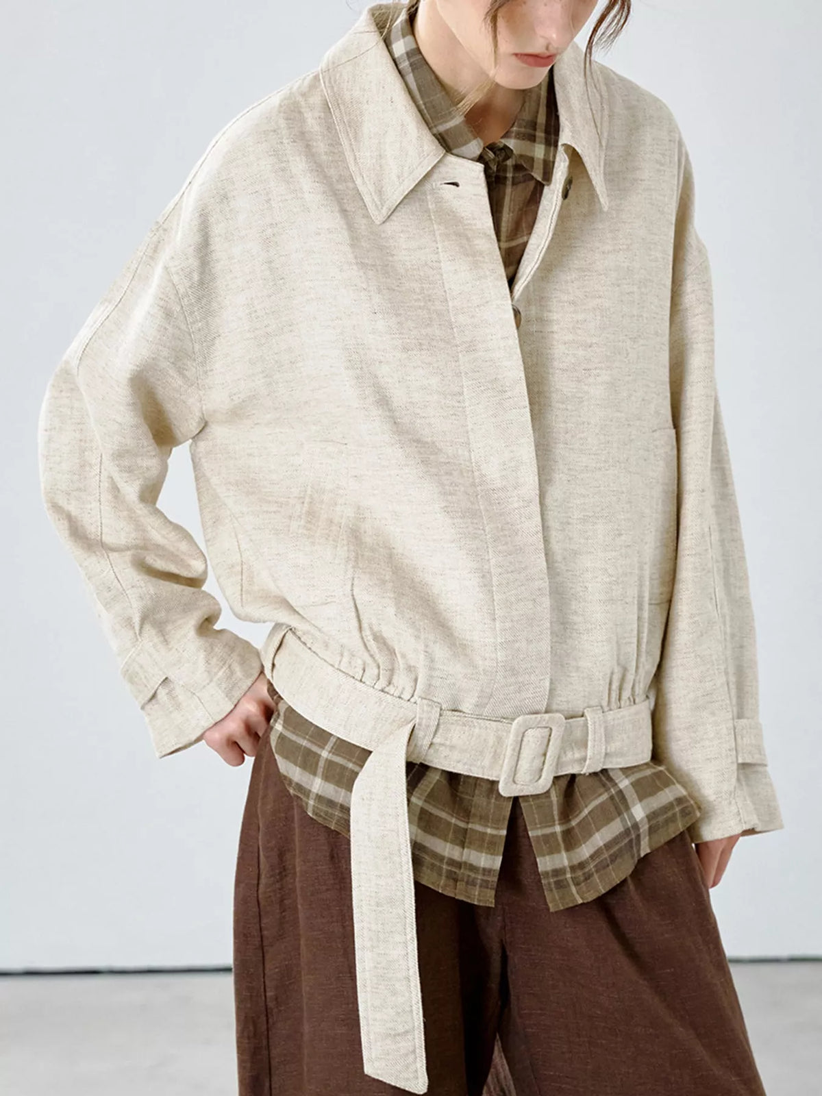 Cream belted dropped shoulder jacket — front view