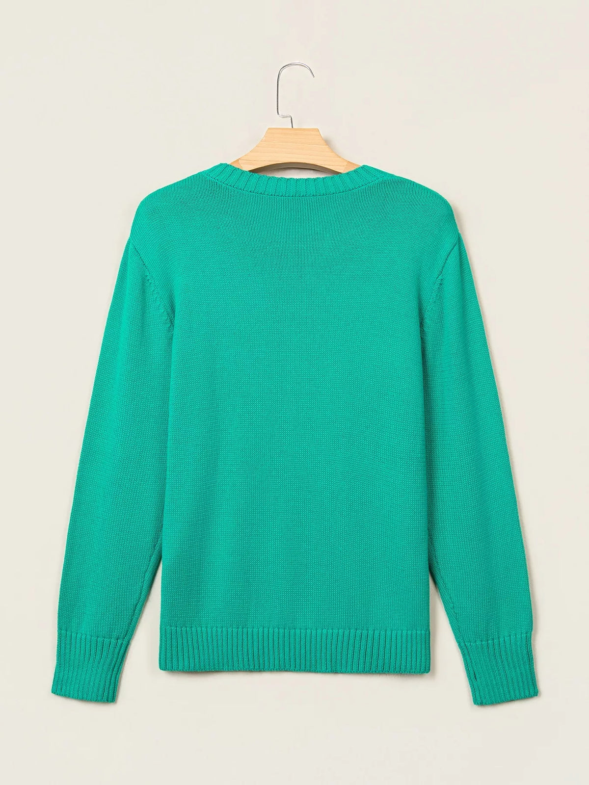 Merry sweater, green hanging back
