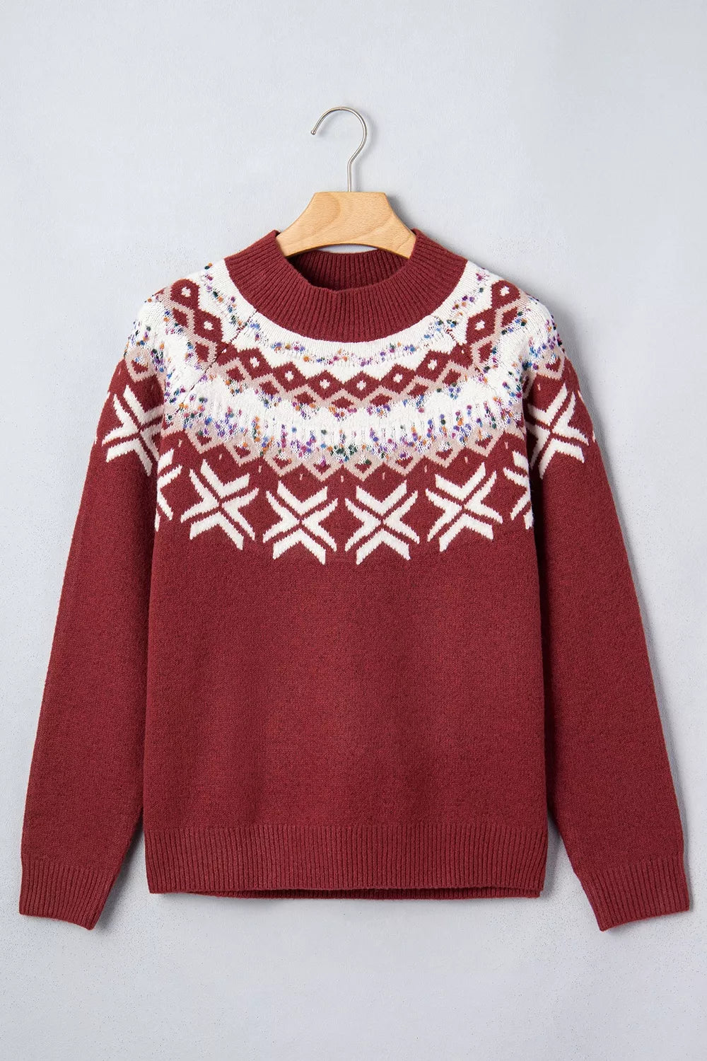 Burgundy Christmas geometric sweater, front on hanger