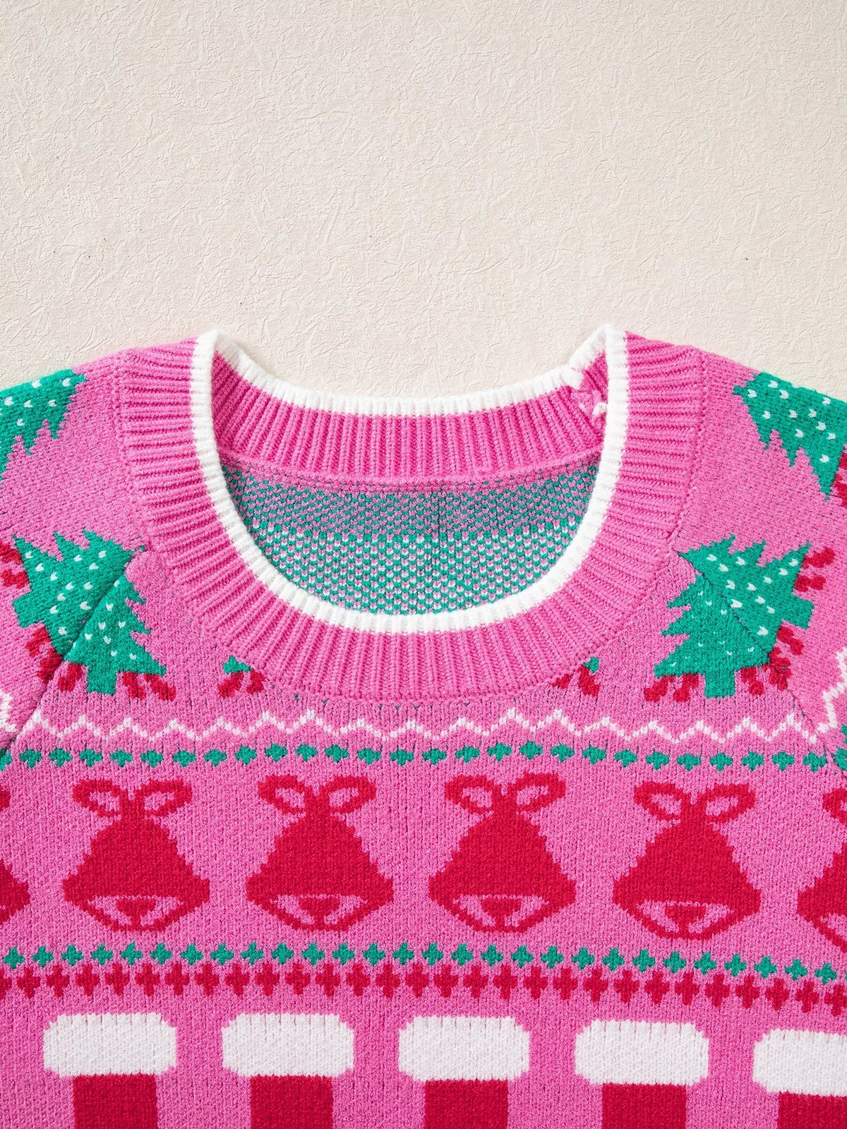 Pink Christmas graphic sweater, neckline and Christmas motifs