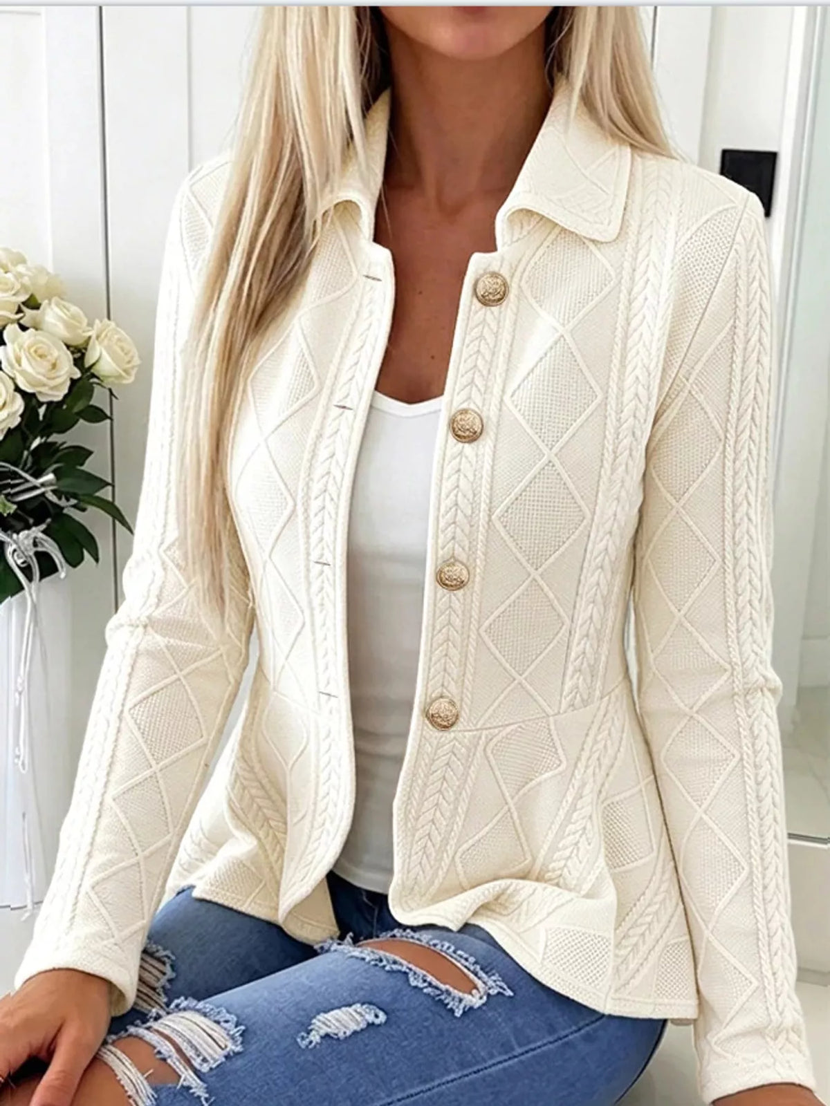 White cable-knit button-up cardigan — front view