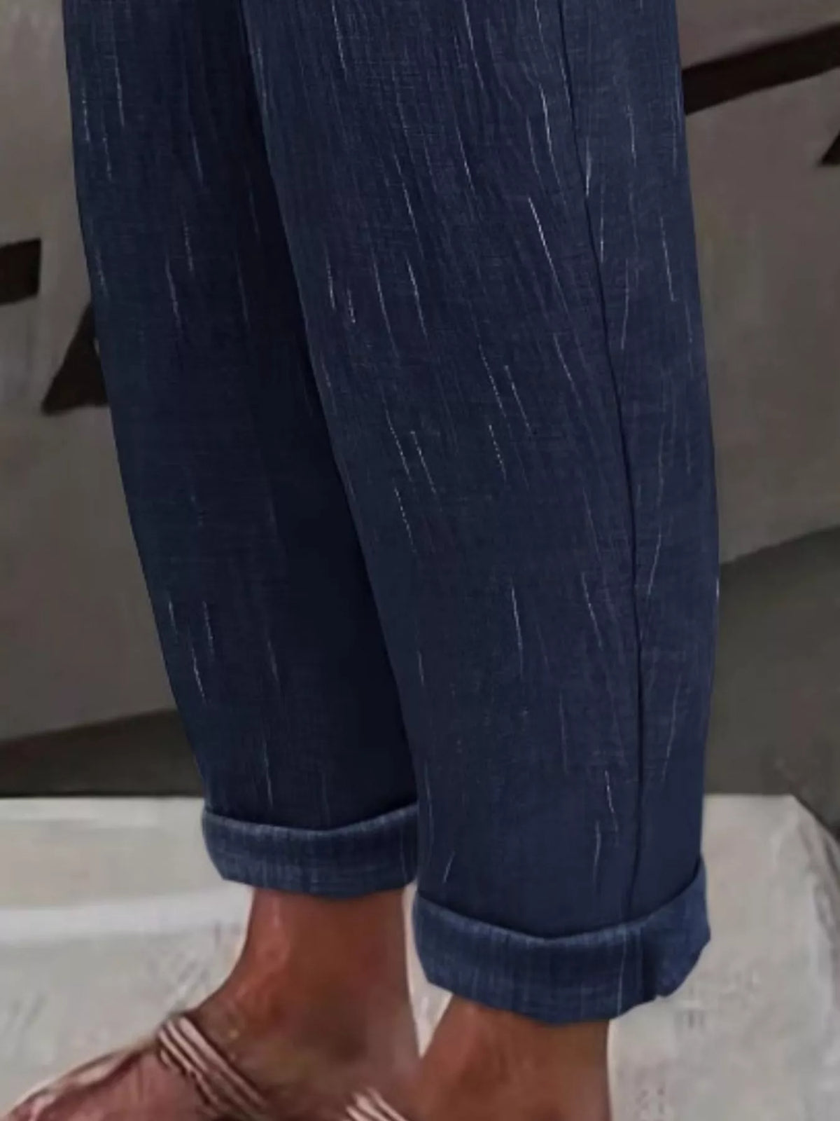 Navy loose fit cropped pants, cropped rolled cuff and fabric texture