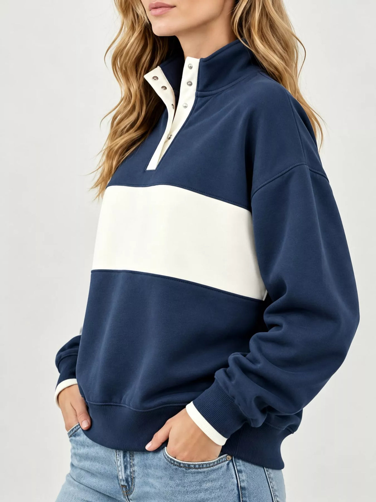 Navy and cream color block snap-button sweatshirt, side view