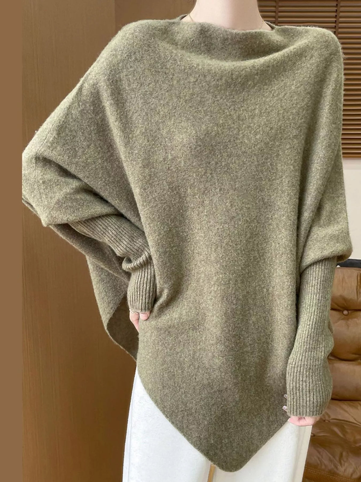 Green asymmetrical lantern sleeve sweater — front view