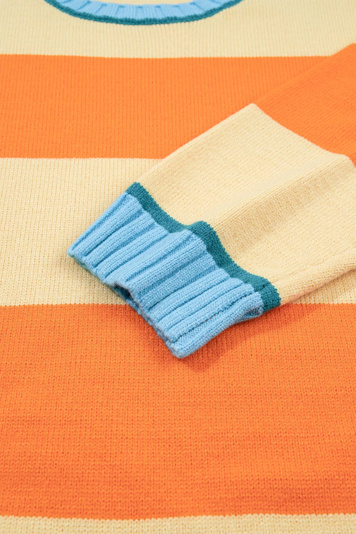 Striped colorblock sweater, blue cuff detail