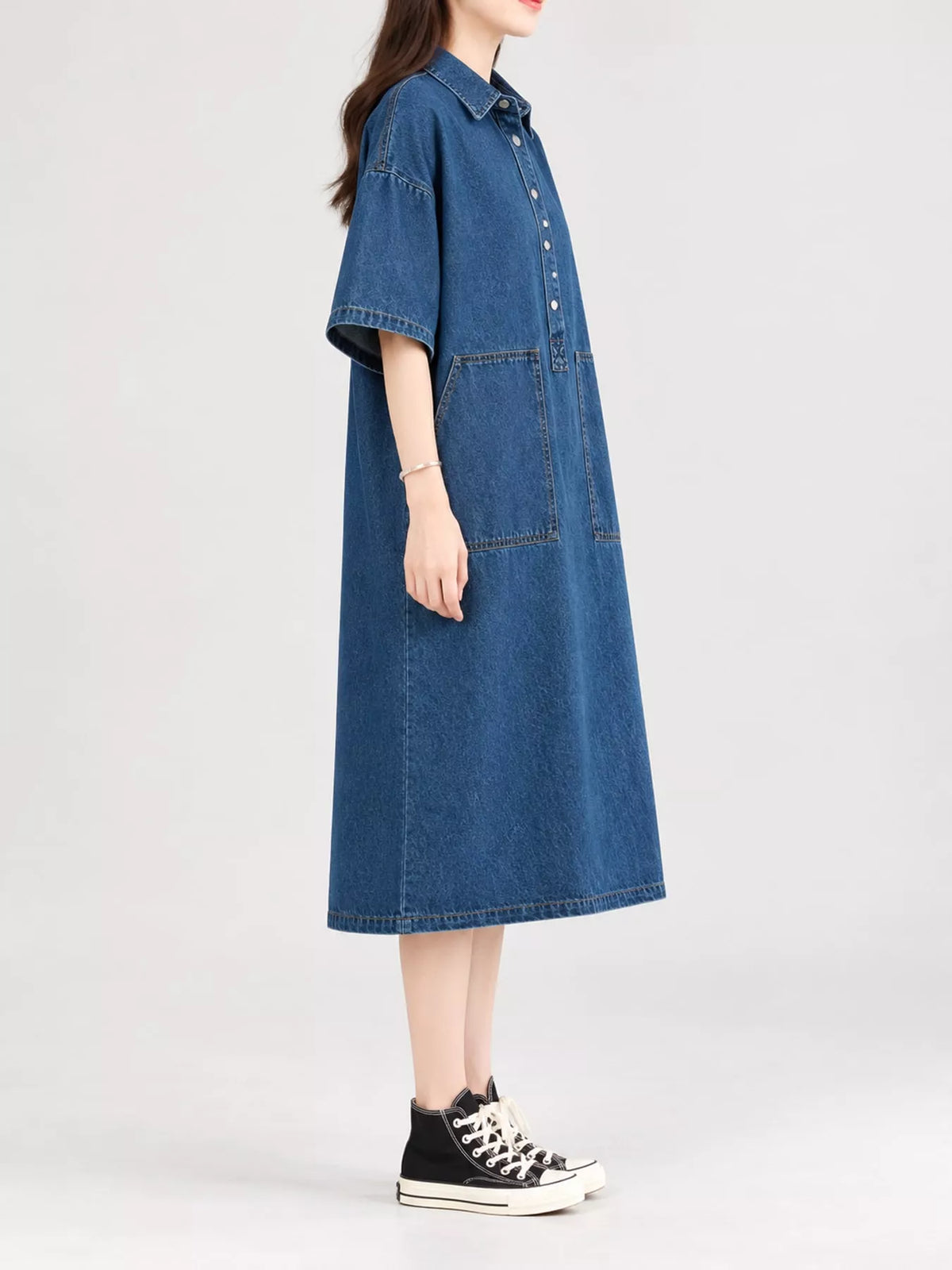 Blue button front denim shirt dress, side view