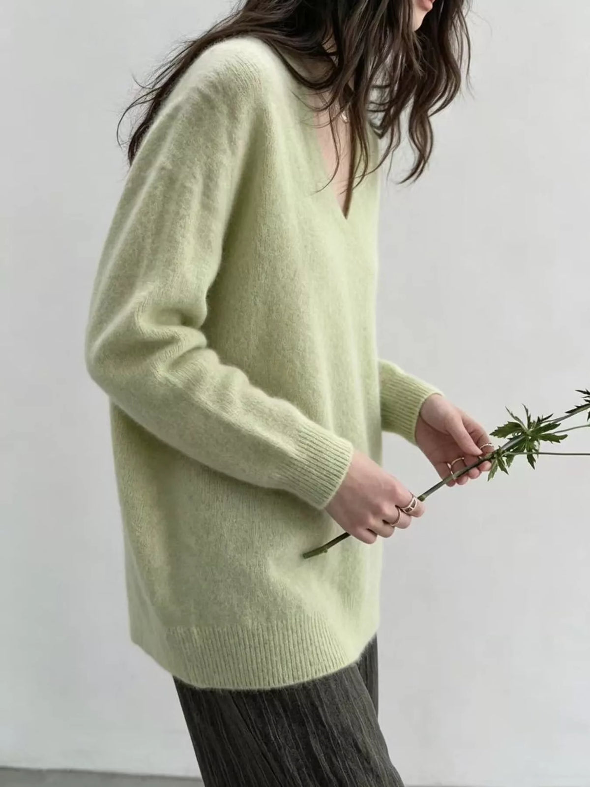 Light green v-neck sweater, side view