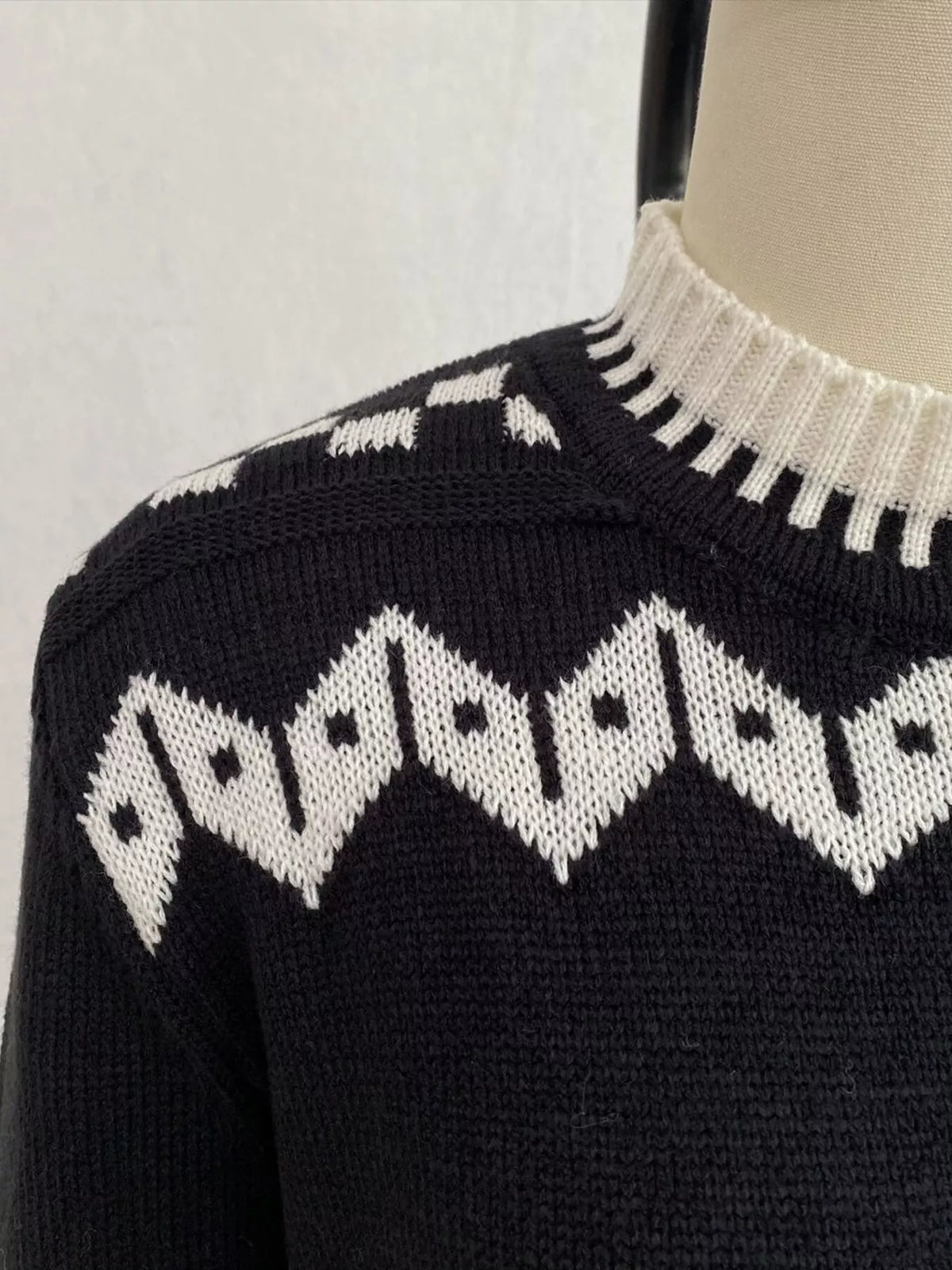 Black and white christmas fair isle crewneck sweater, crew neckline and knit detail.