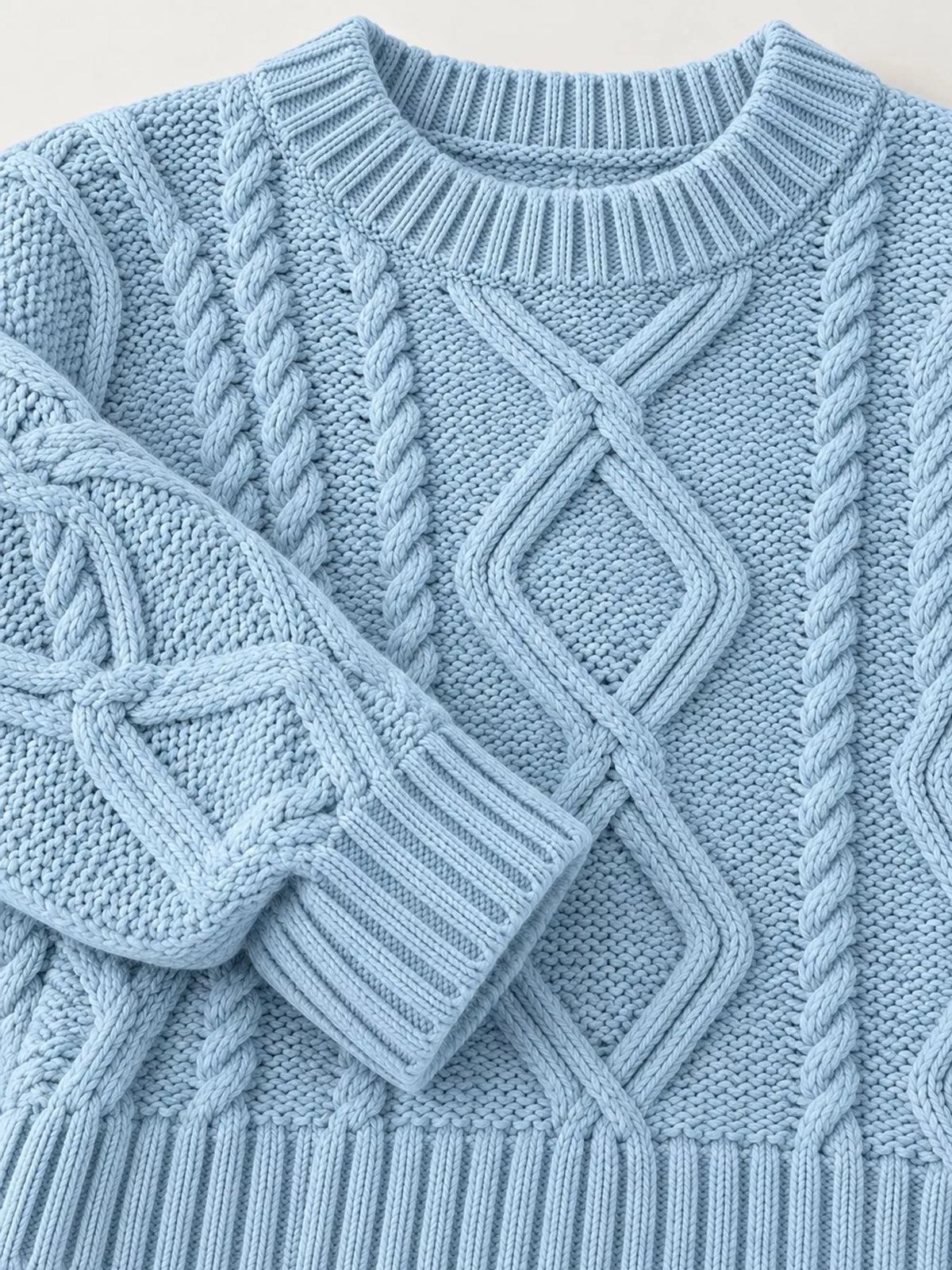 Blue cable-knit round neck sweater, detail view