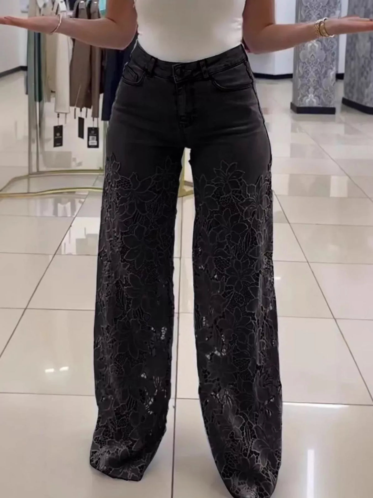 Black lace cutout wide-leg jeans — front view
