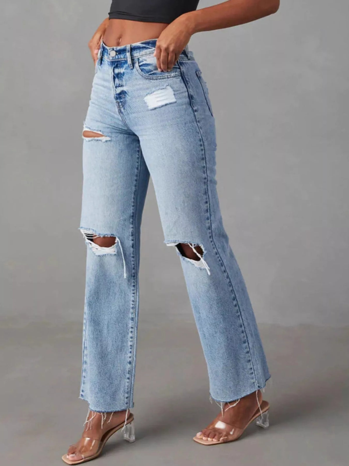 Blue high-waisted distressed jeans