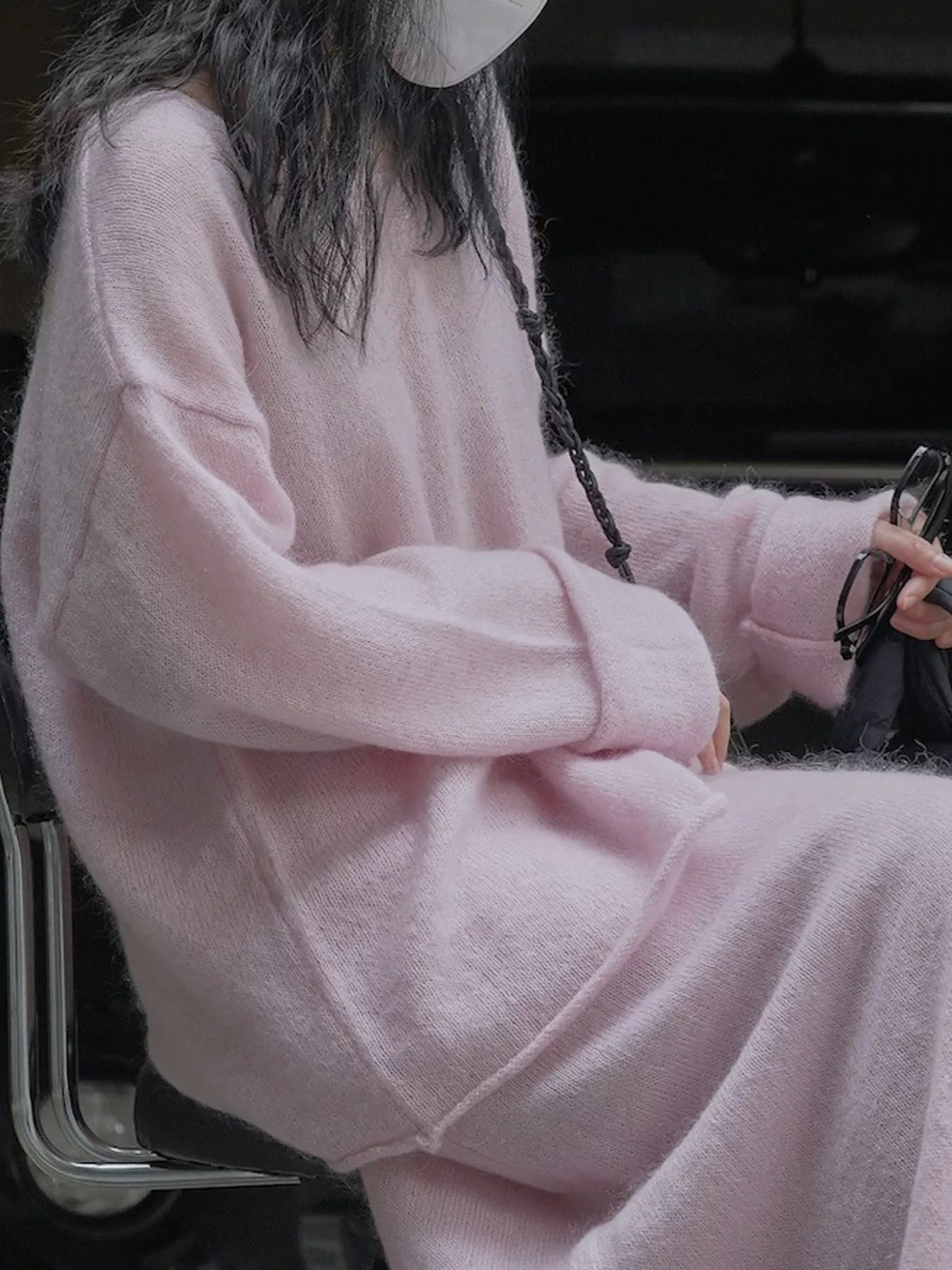 Pink round neck sweater, side view