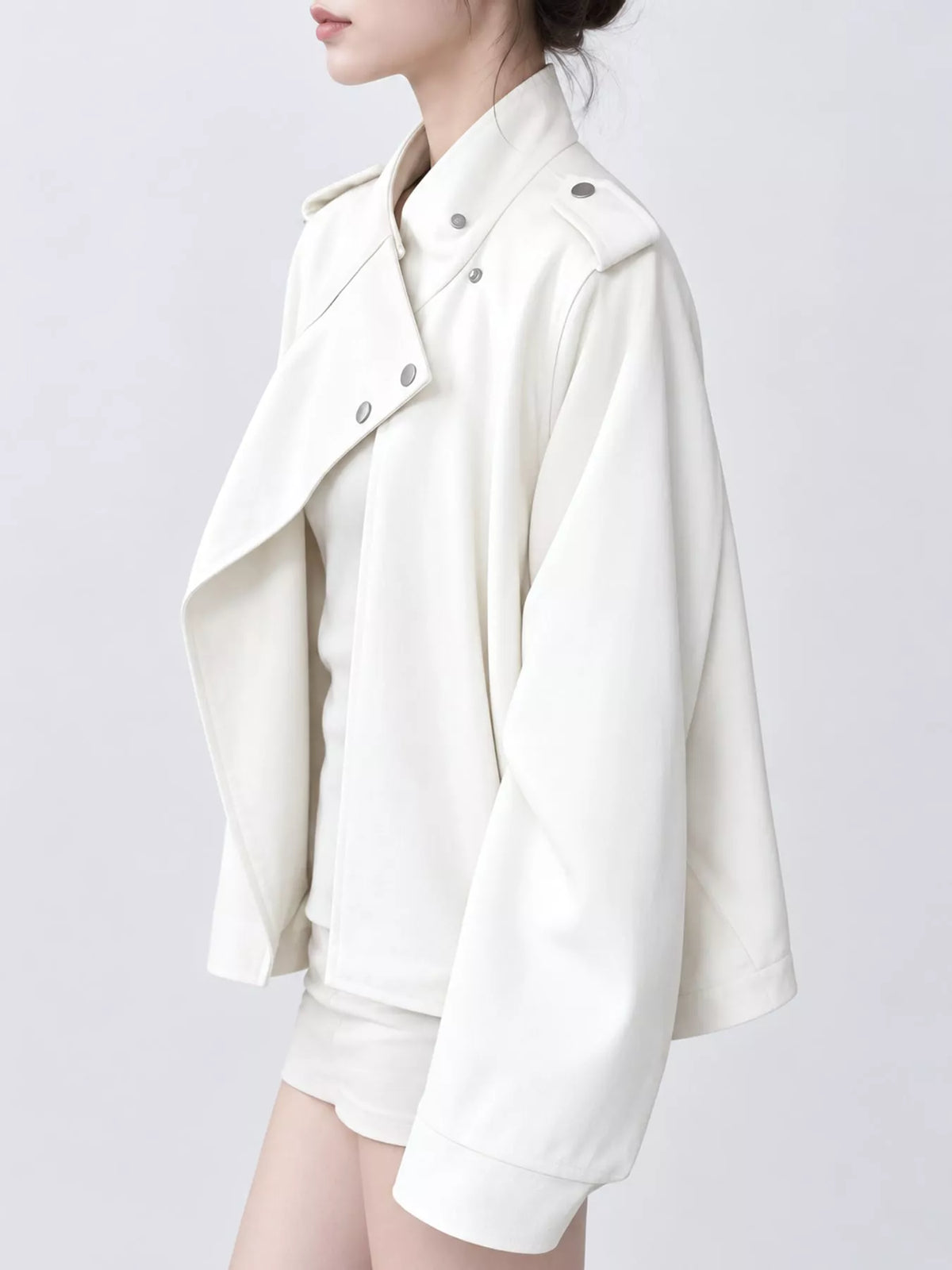 Cream asymmetric zip-up moto-style jacket, side view