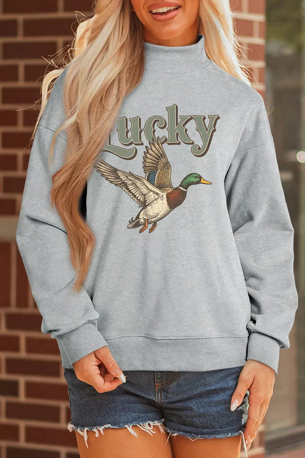 Gray lucky mallard graphic mock-neck sweatshirt, standing front view.
