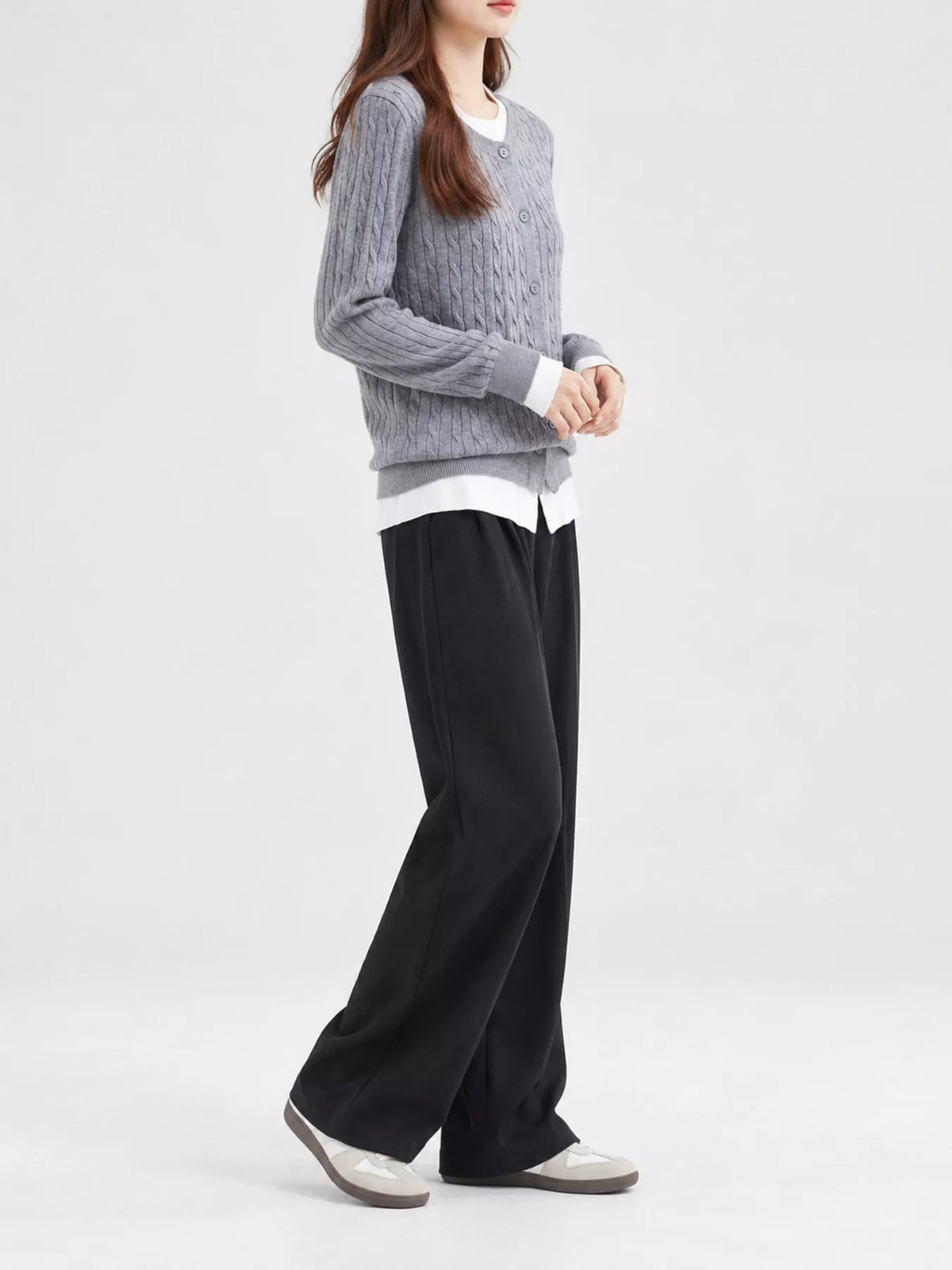 Gray cable-knit button-down cardigan, side view