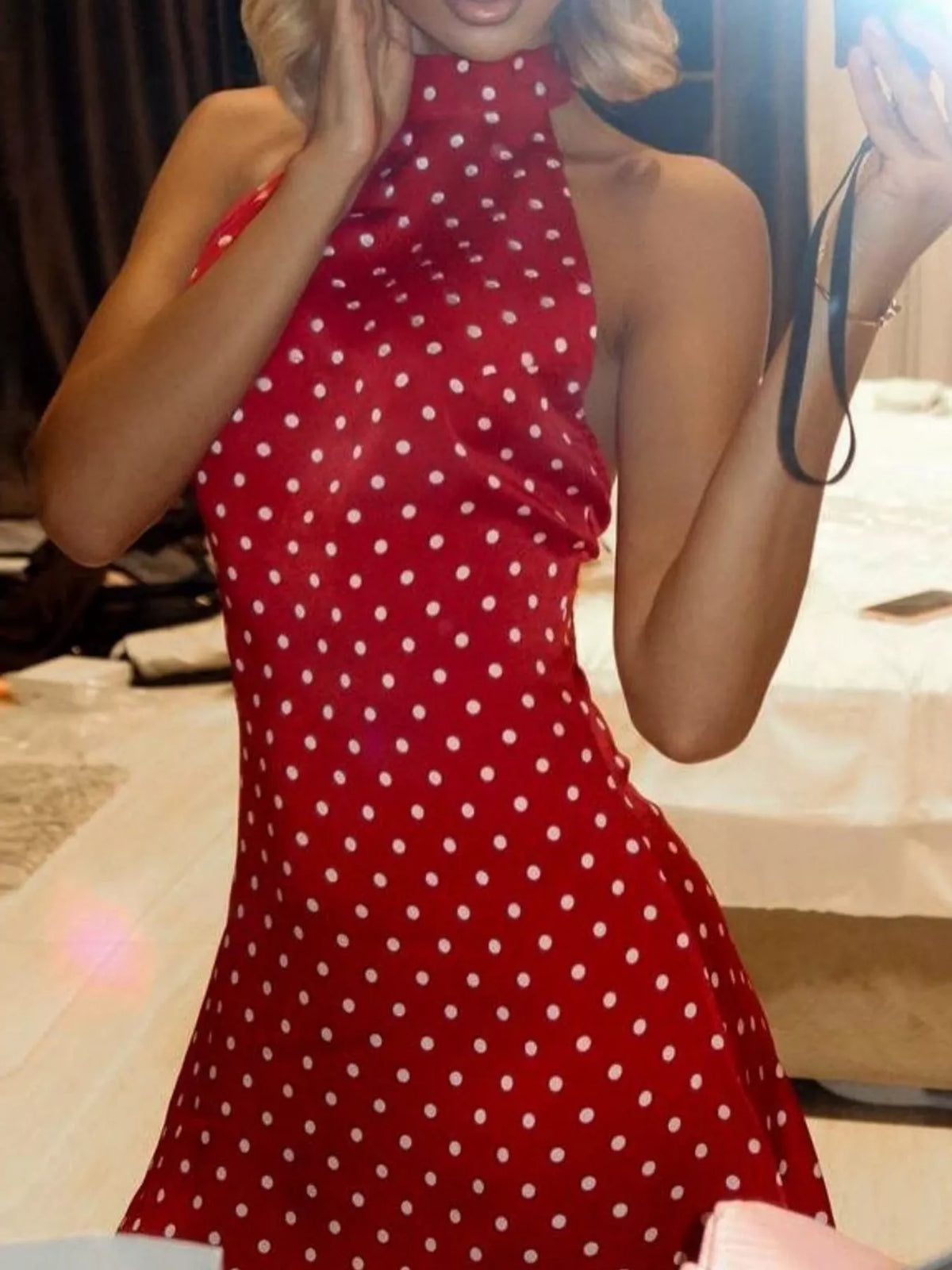 Red and white polka dot halter neck mini dress, detail view