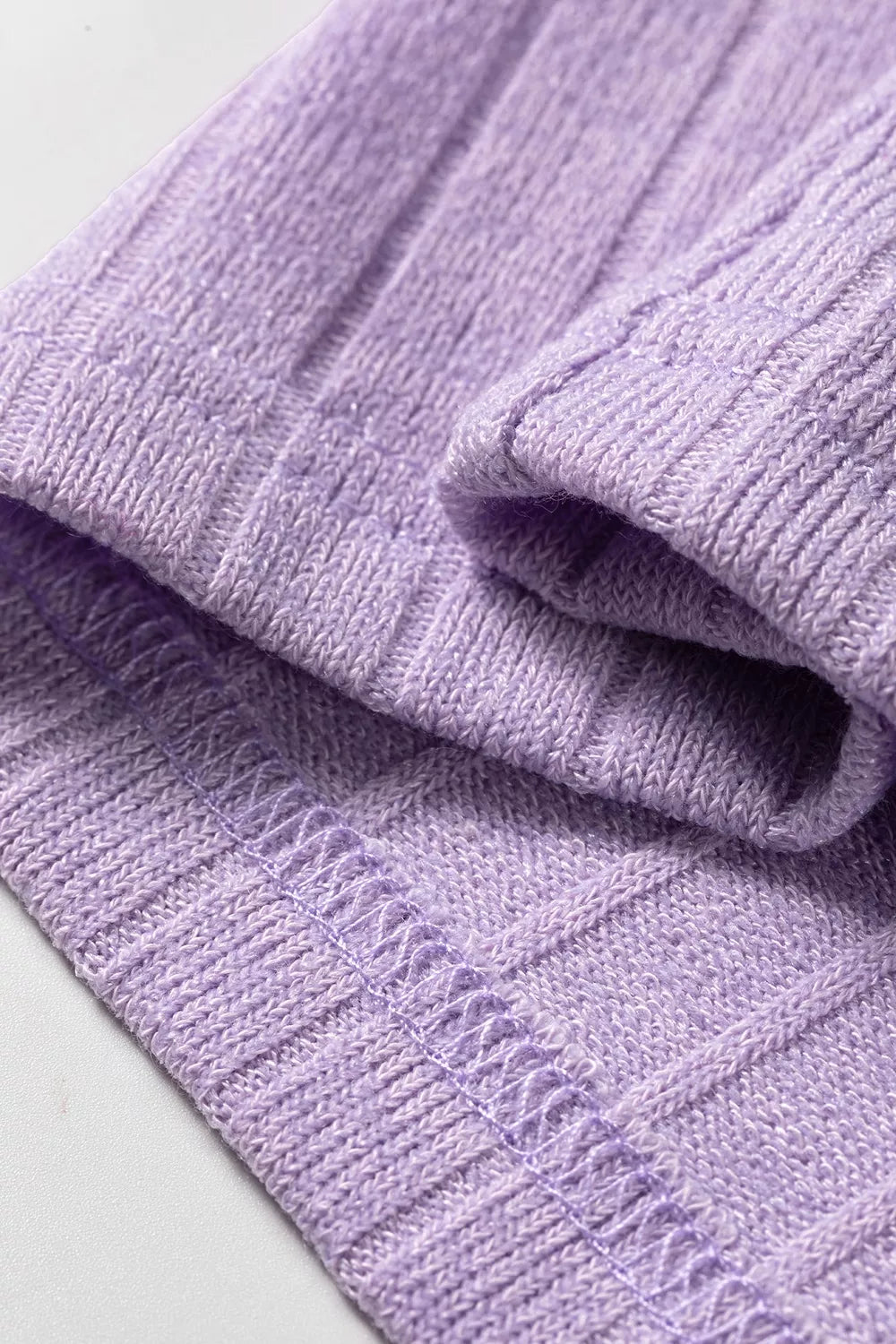 Purple ribbed long sleeve top, hem detail
