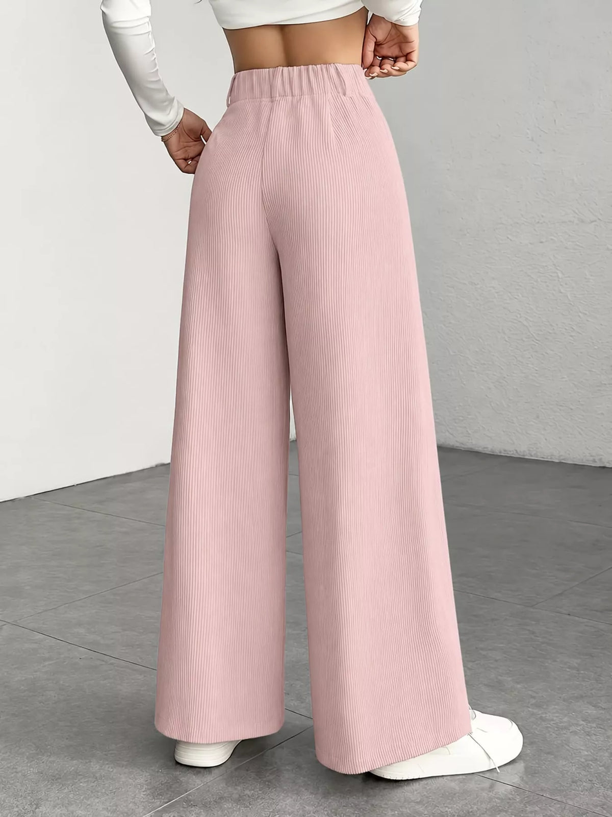 Pink high-waisted wide-leg pants, back view